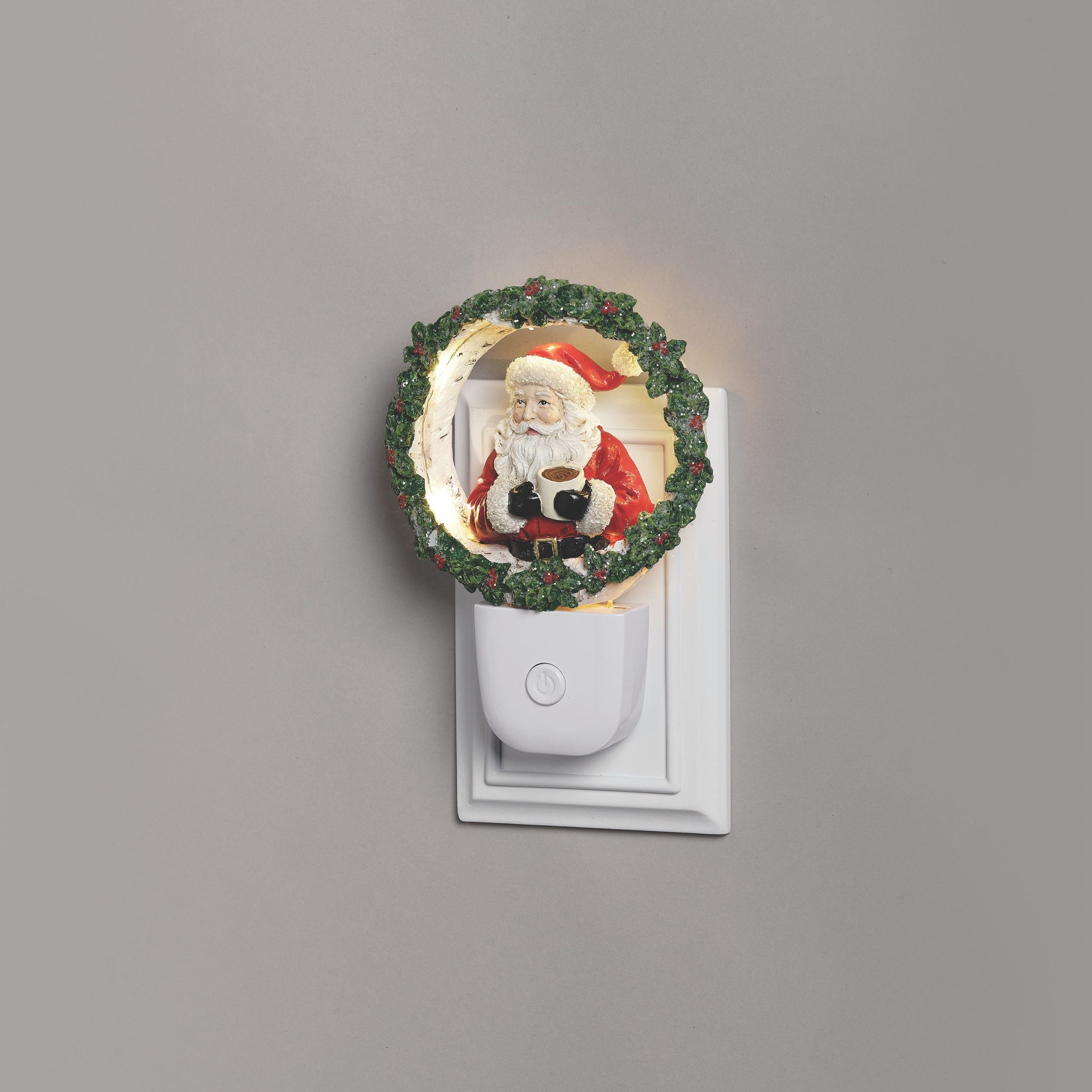 Decorative night light with Santa Claus design on a gray background