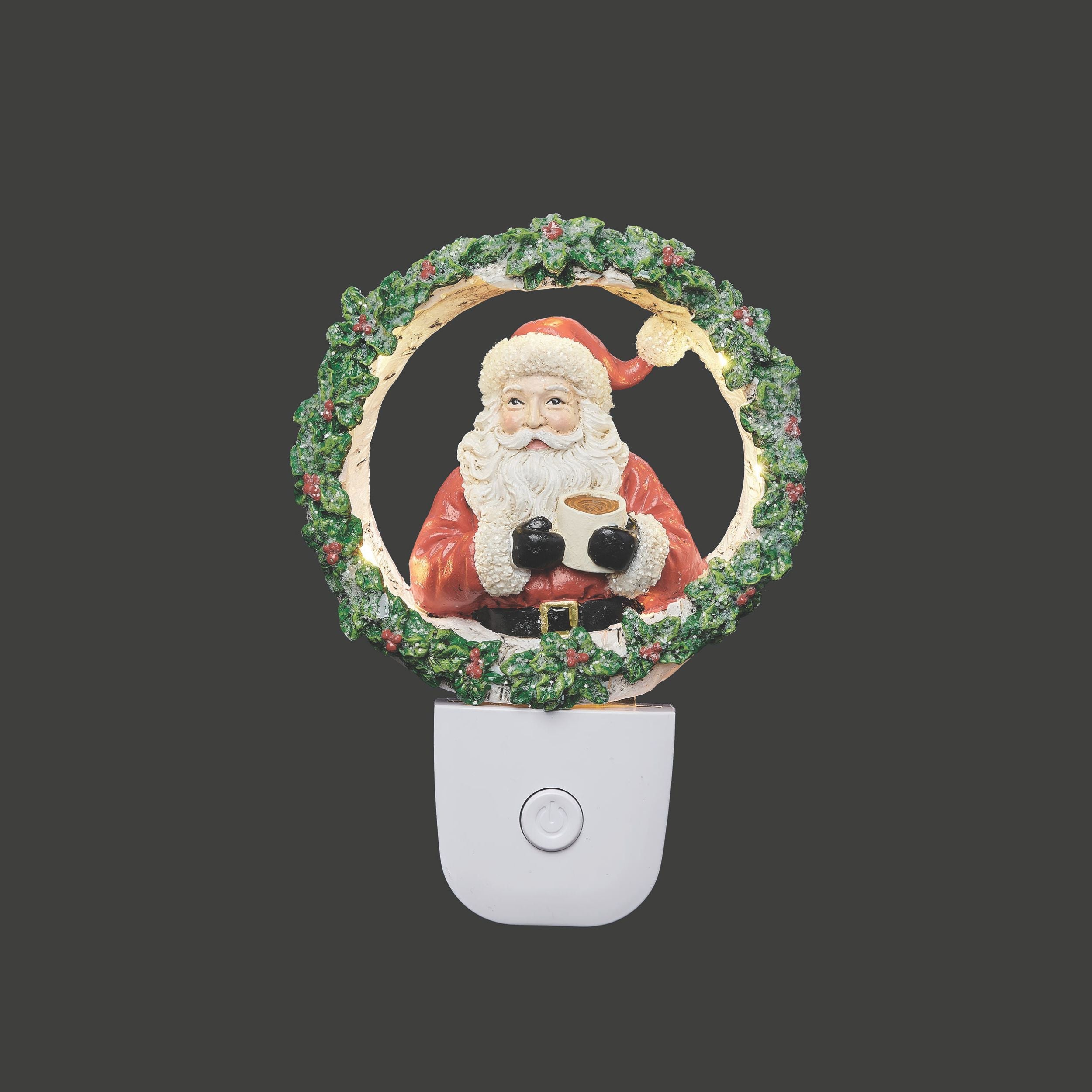 Decorative night light with Santa Claus design on a dark background