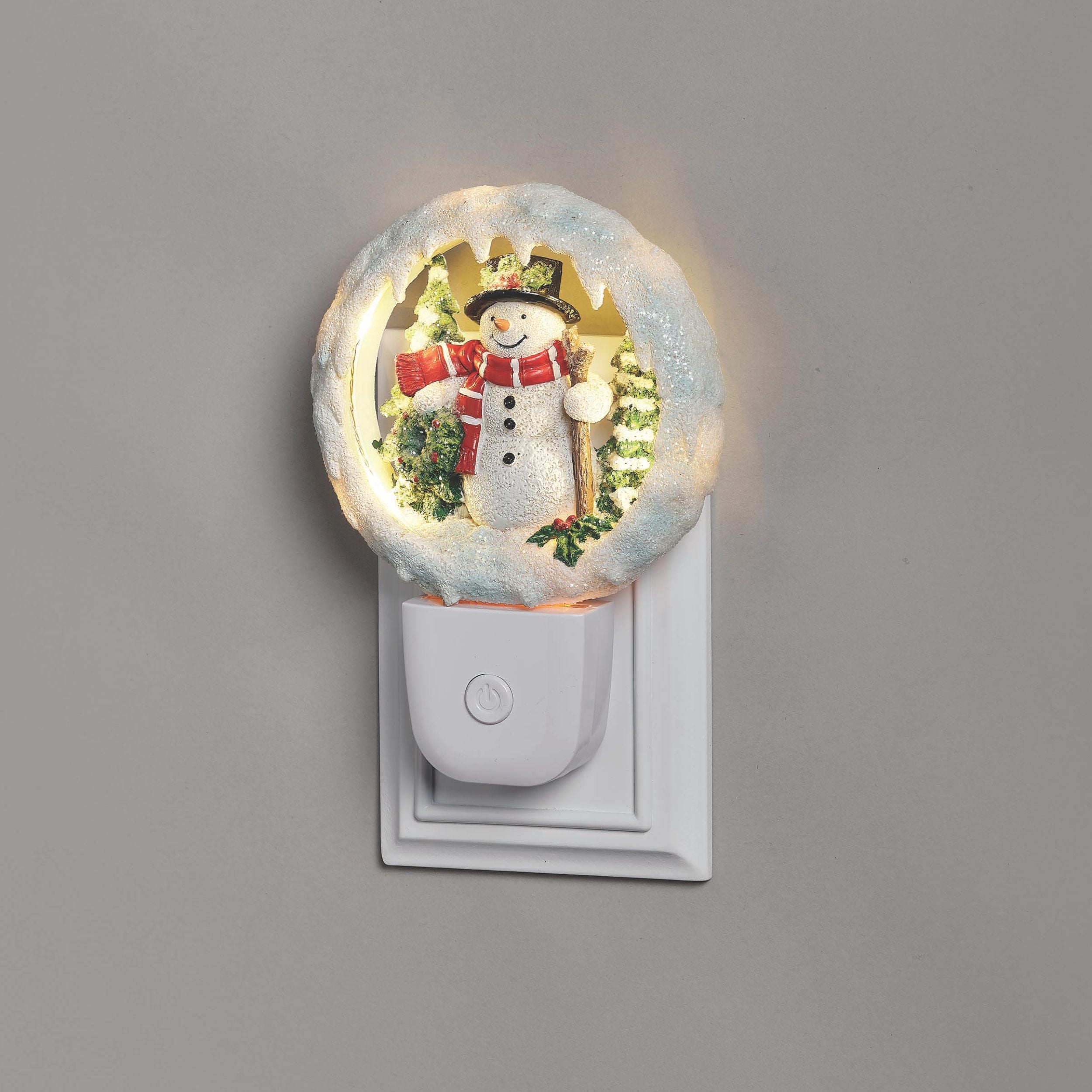Decorative night light with a snowman design on a gray background