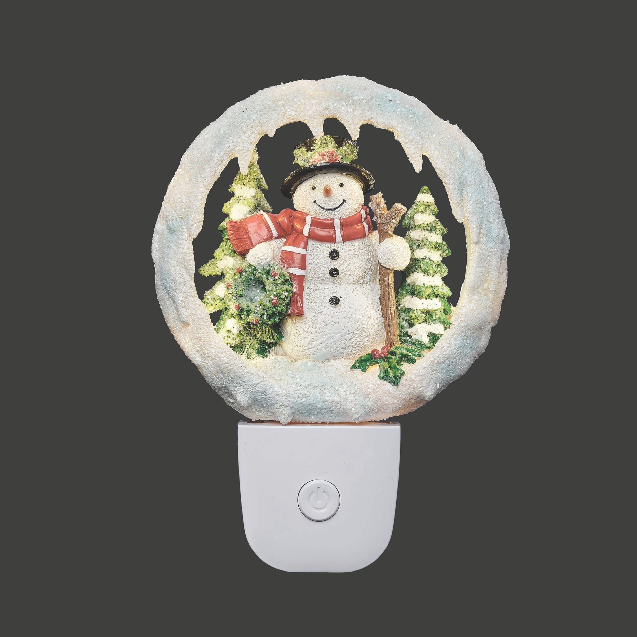 Decorative night light with a snowman design on a dark background