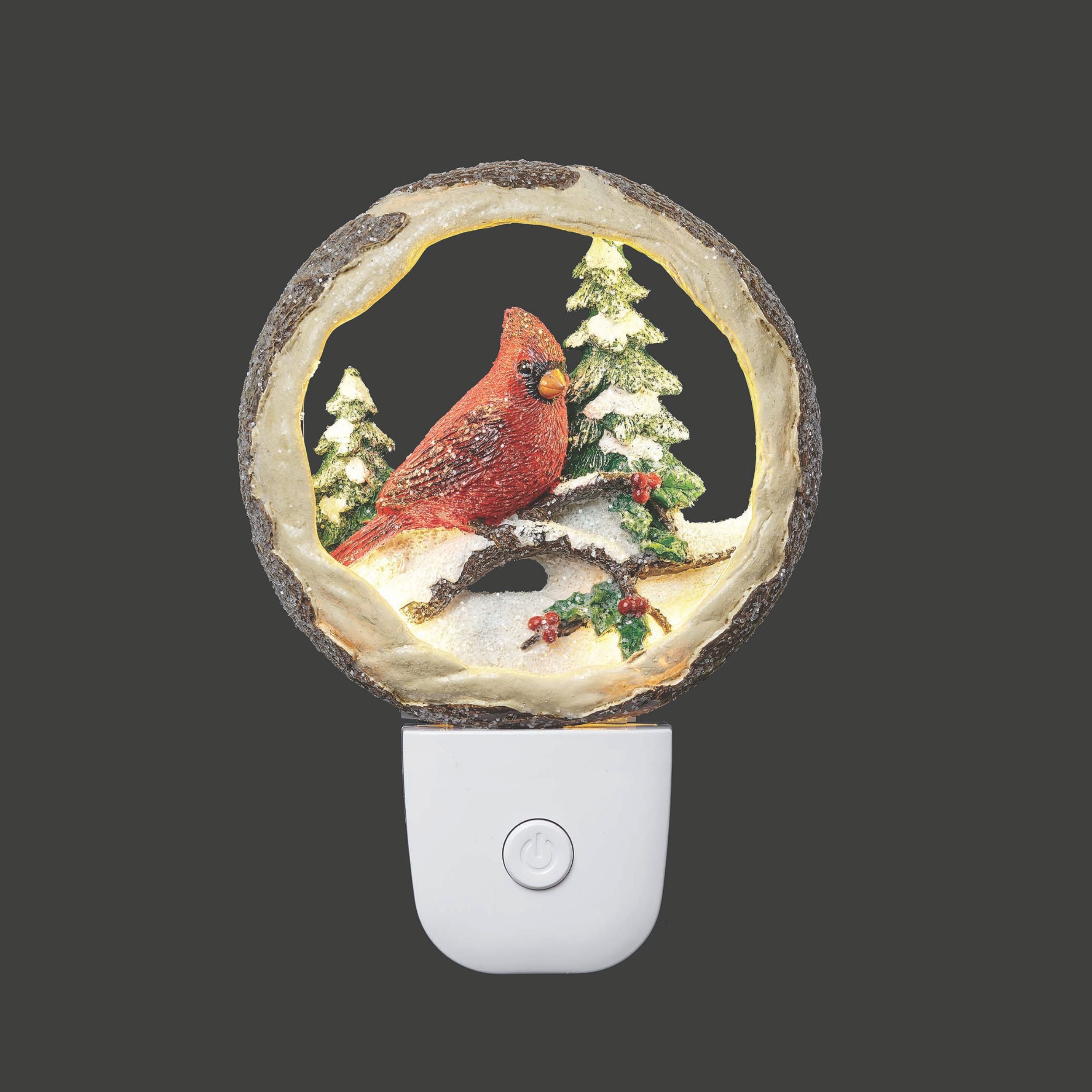 Decorative night light with a cardinal design on a dark background