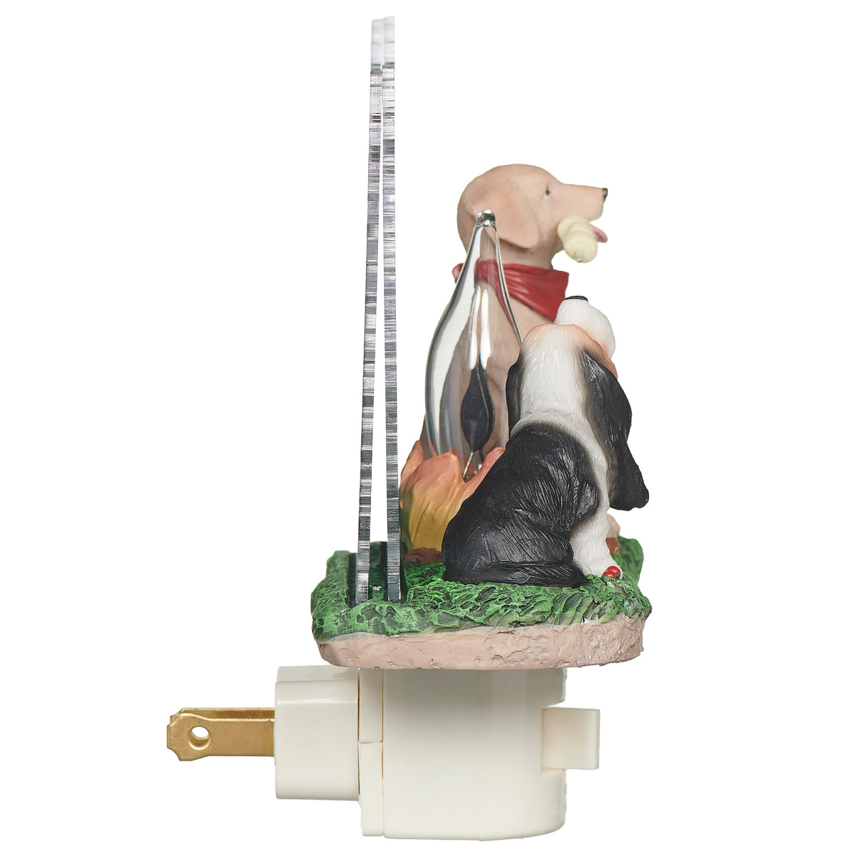Decorative night light with two dogs by a campfire, one holding a marshmallow stick
