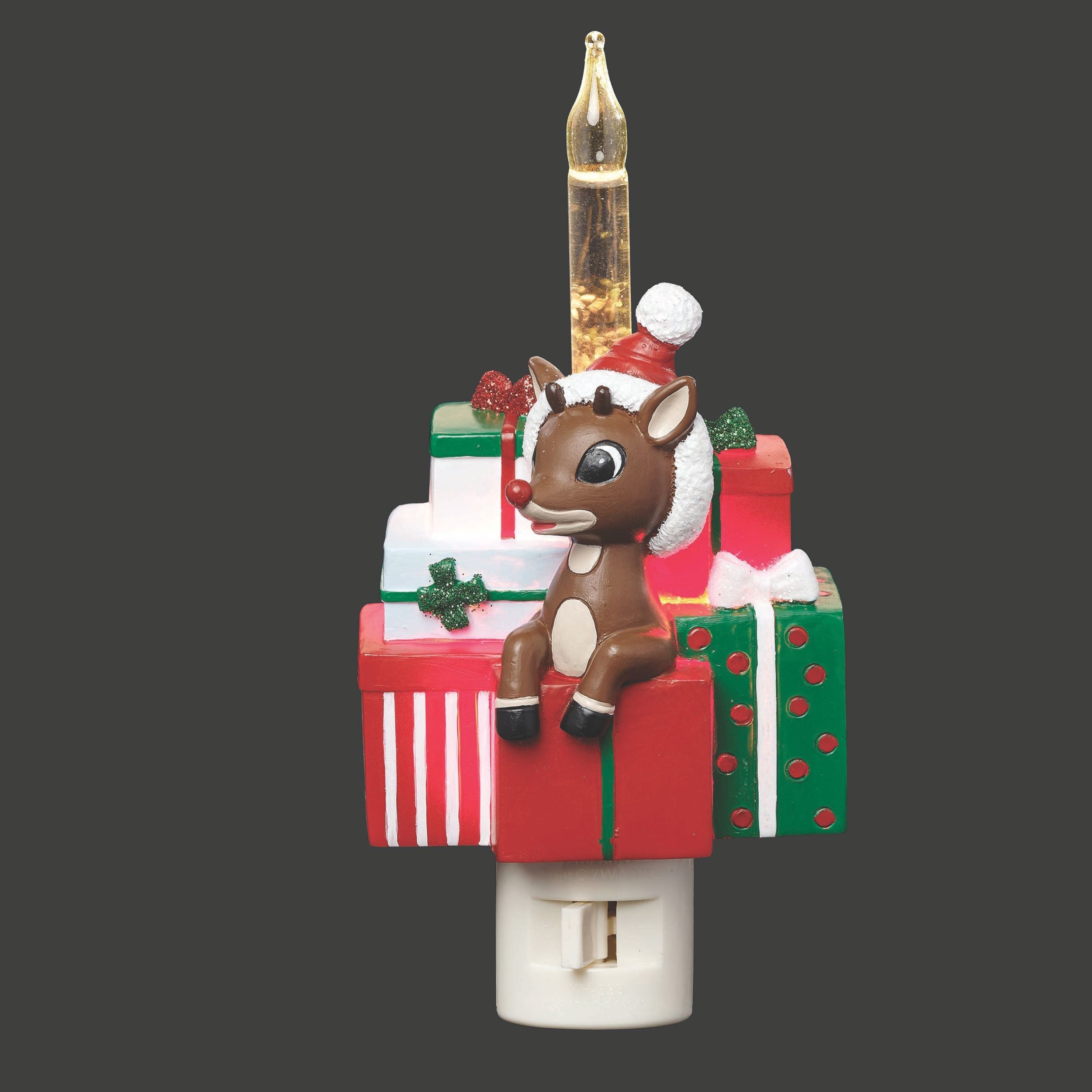 Christmas-themed night light with a reindeer, presents, and a candle on a gray background