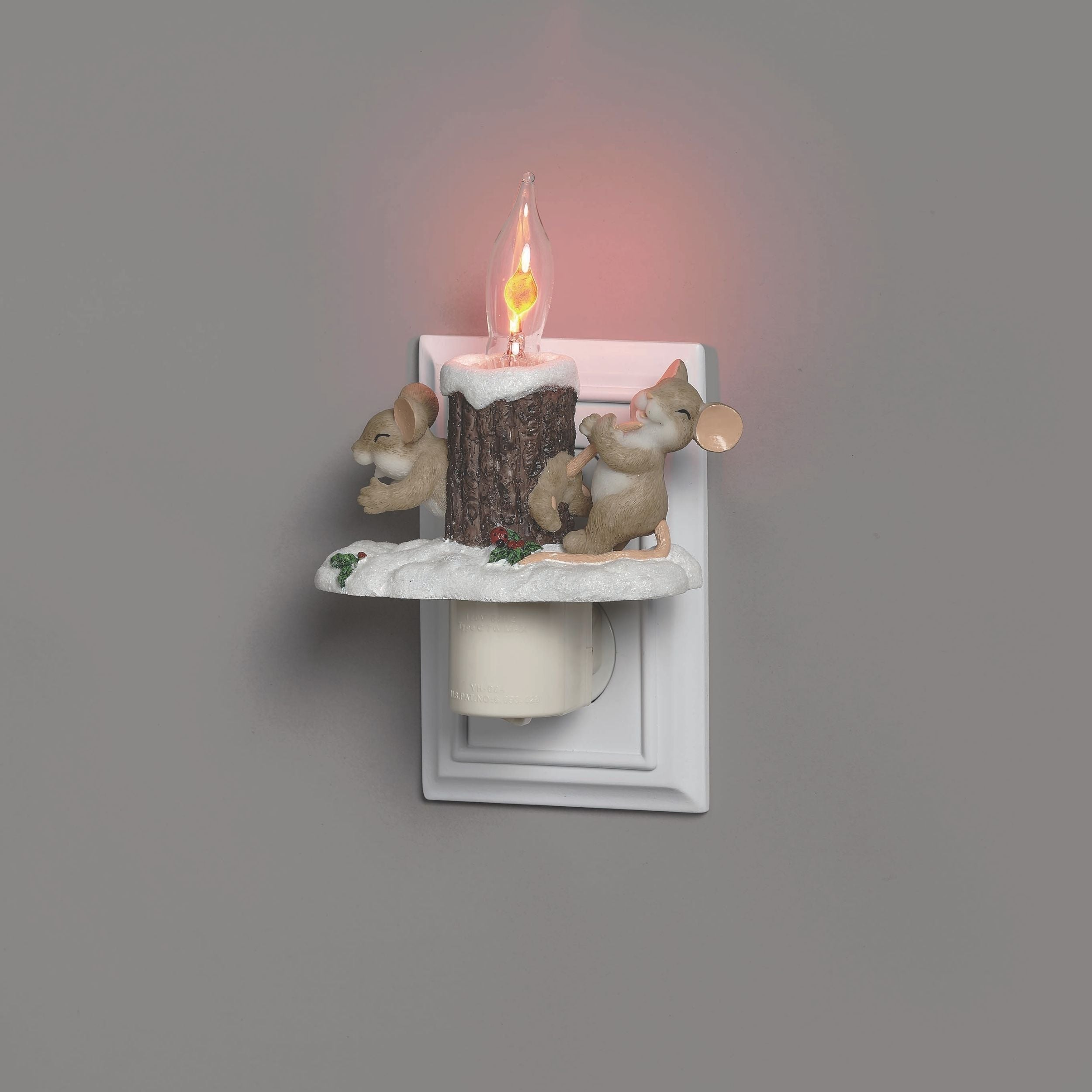Decorative wall light with two mice and a log on a gray background