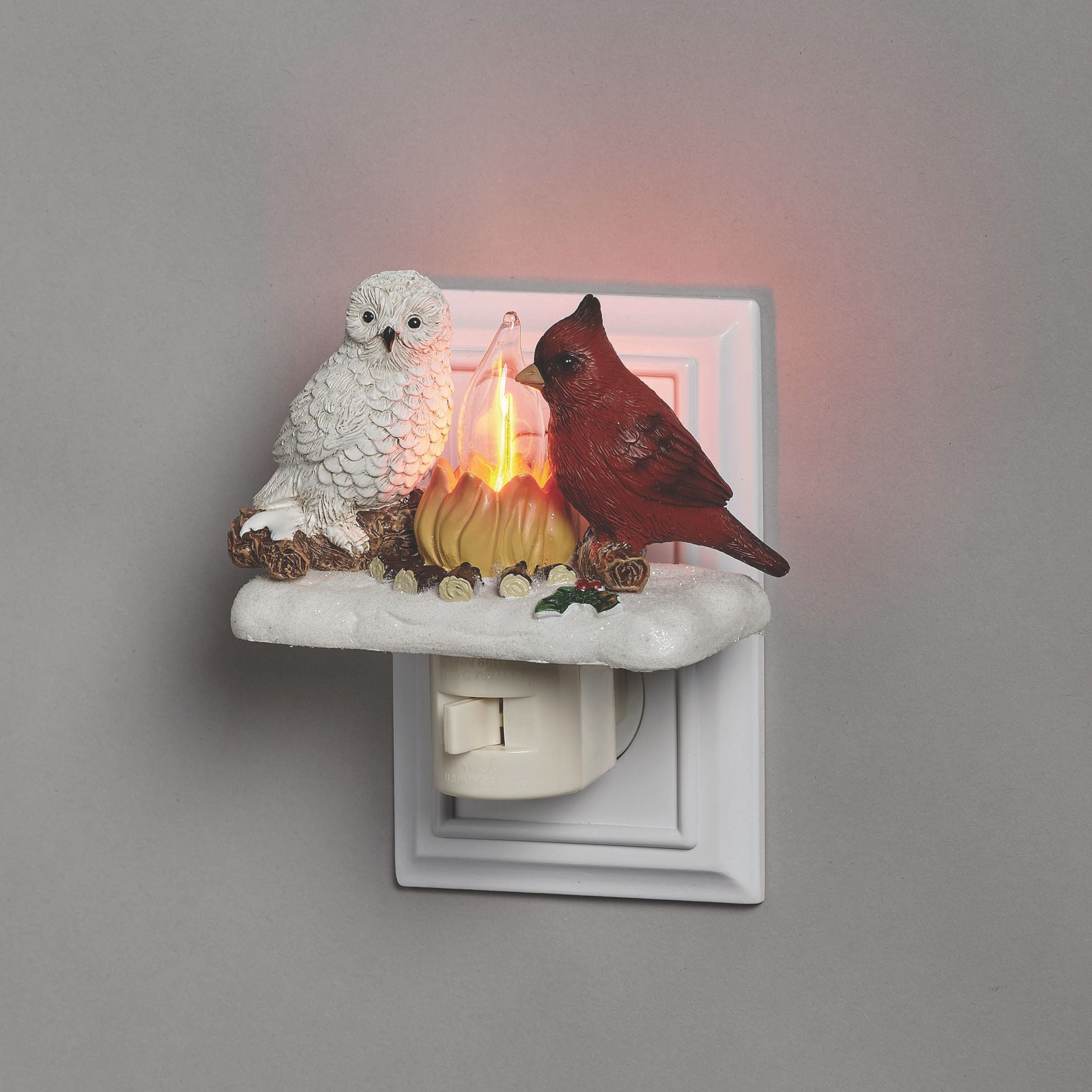 Decorative night light with owl and cardinal figures on a gray background