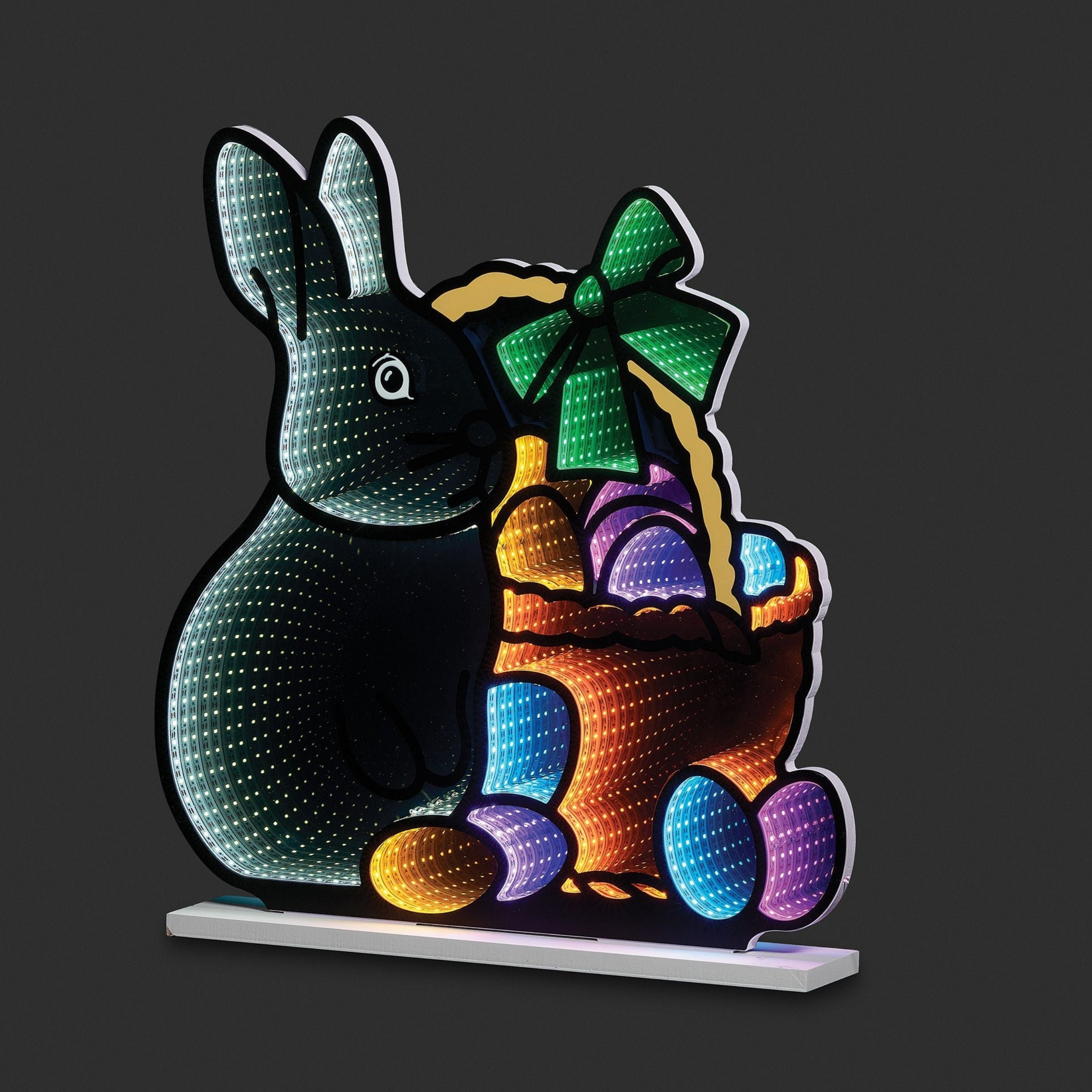 Colorful LED light-up bunny with basket of eggs on a black background