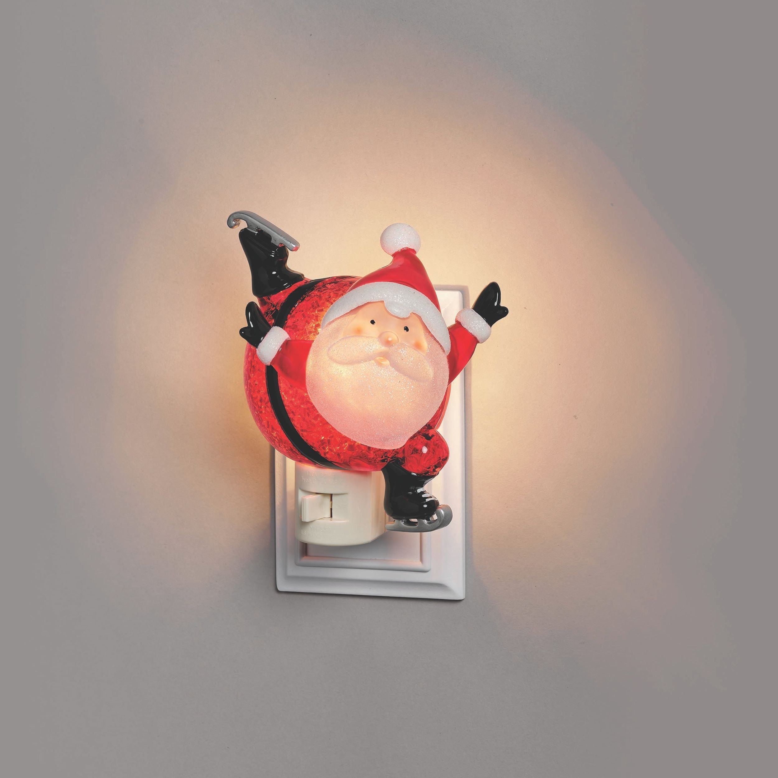 Decorative night light shaped like a Santa Claus figure on a plain background
