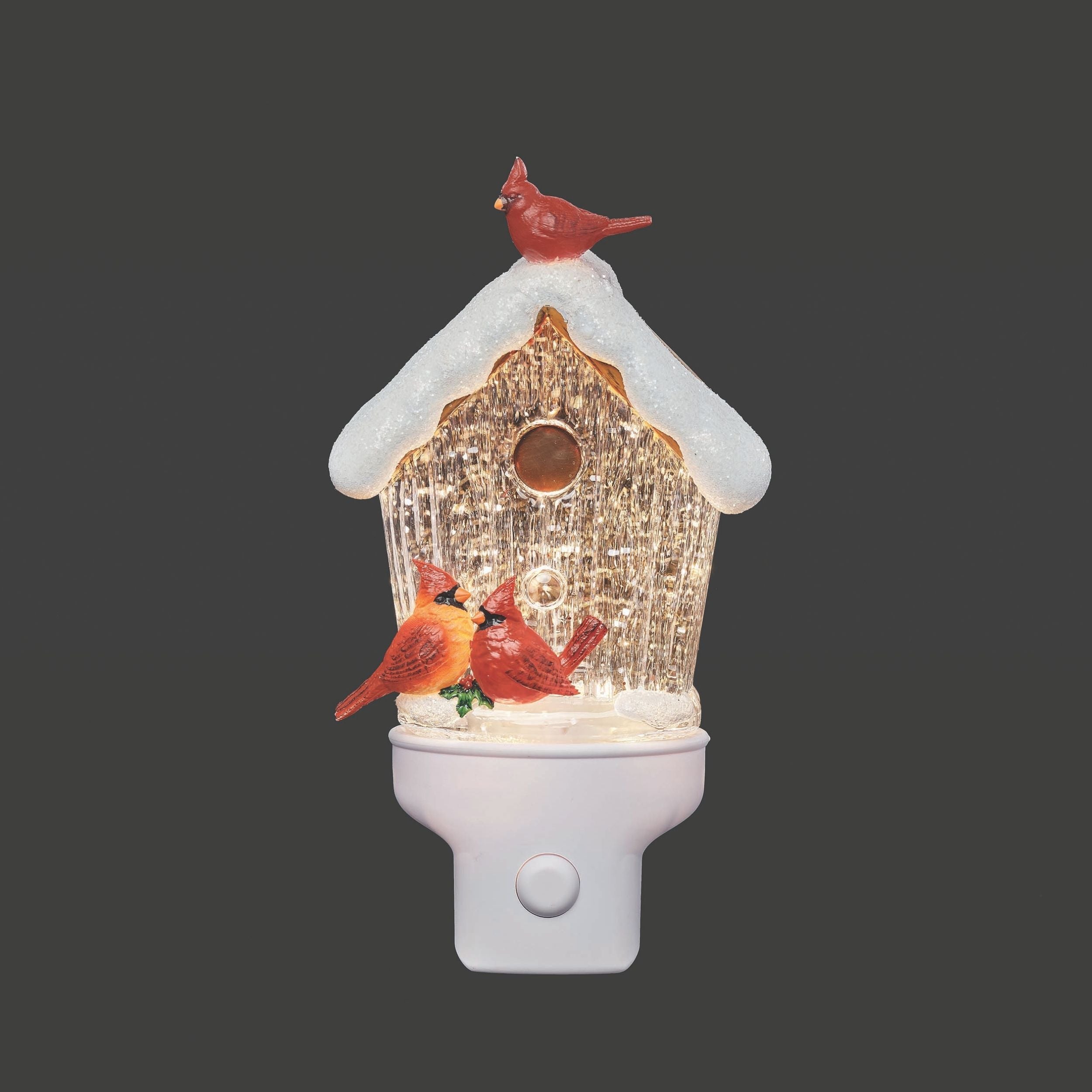 Decorative night light with a birdhouse and cardinals on a dark background