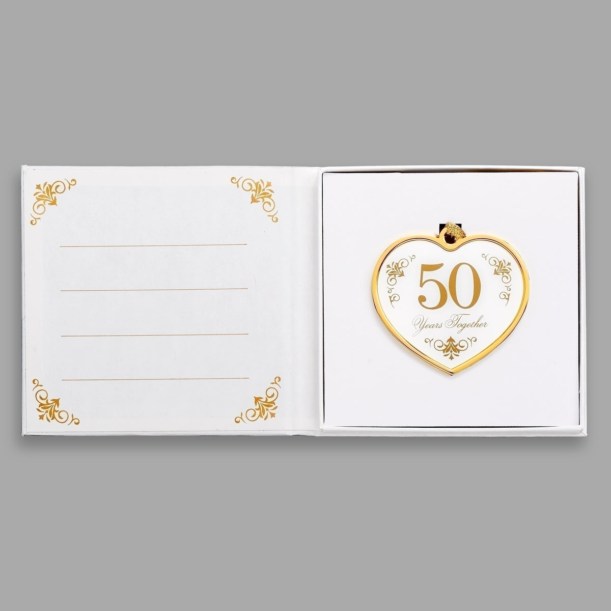 Open keepsake packaging displaying the 50th anniversary heart ornament beside a printed message.