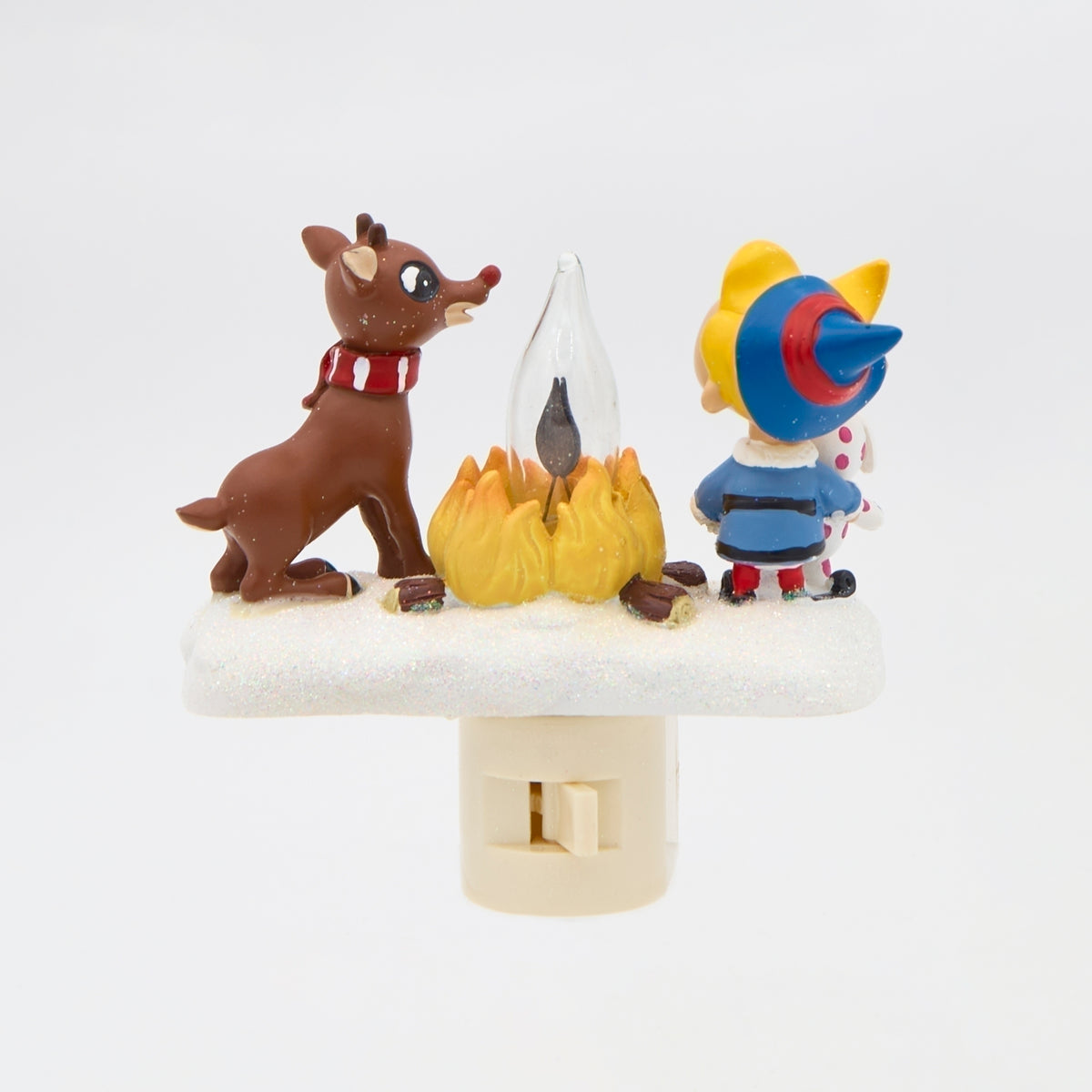 Rear view of Rudolph and Hermey campfire night-light showing both characters beside the fire and the plug facing the camera.