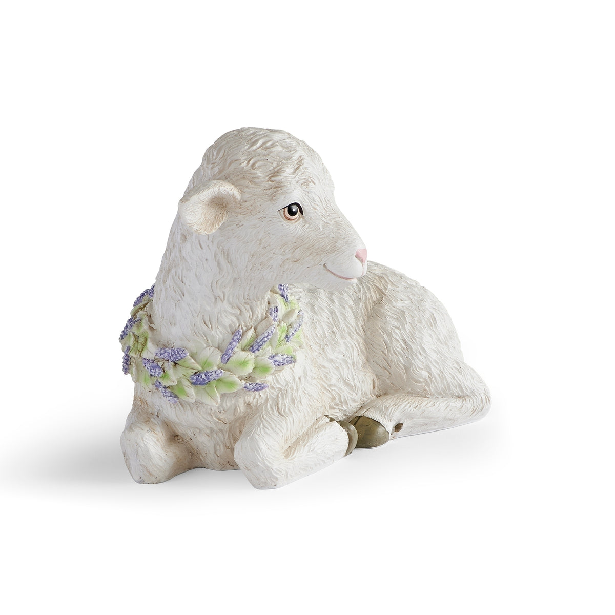 Front view of seated white lamb with floral wreath for Easter decor