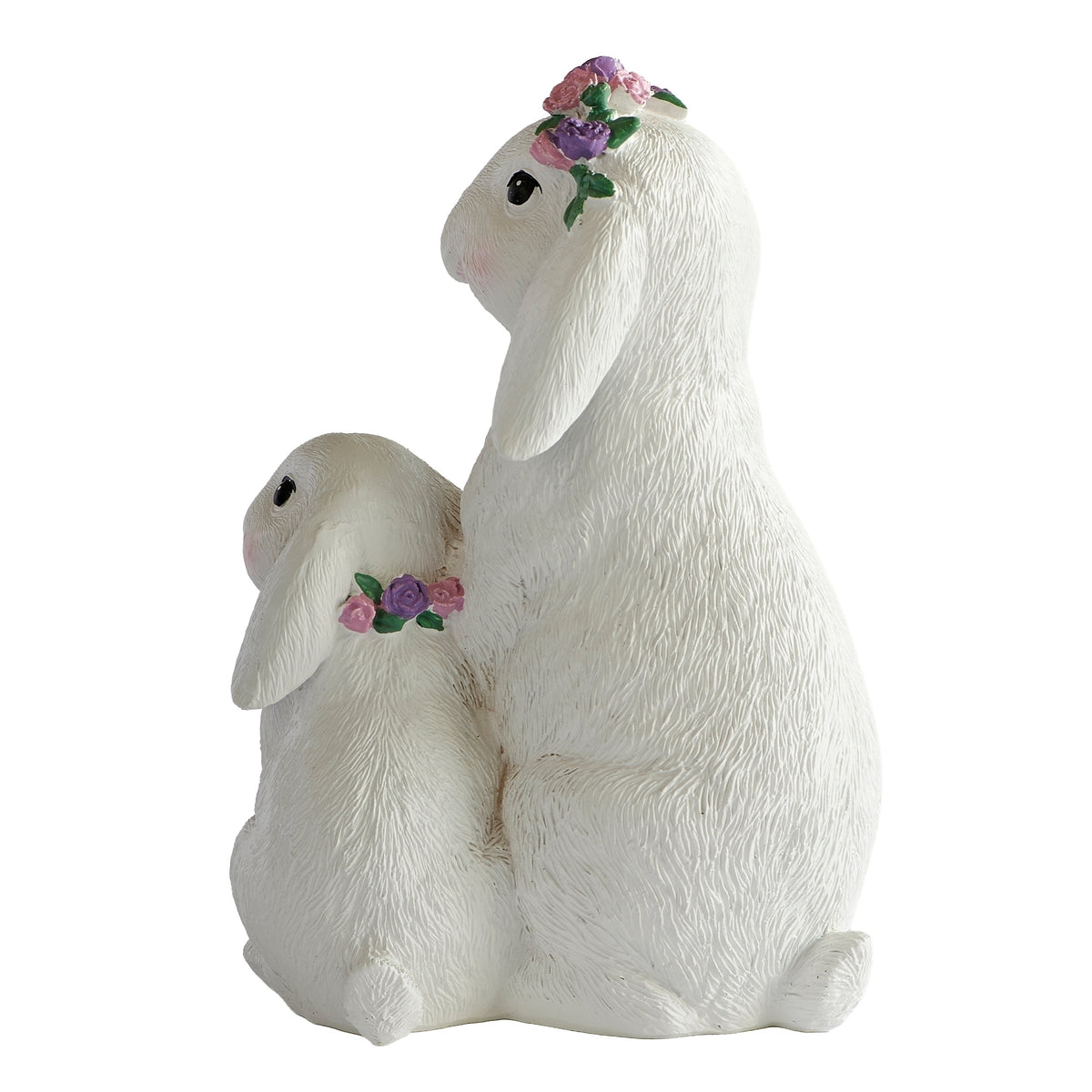 Side view of white Easter bunny pair with pink floral accents