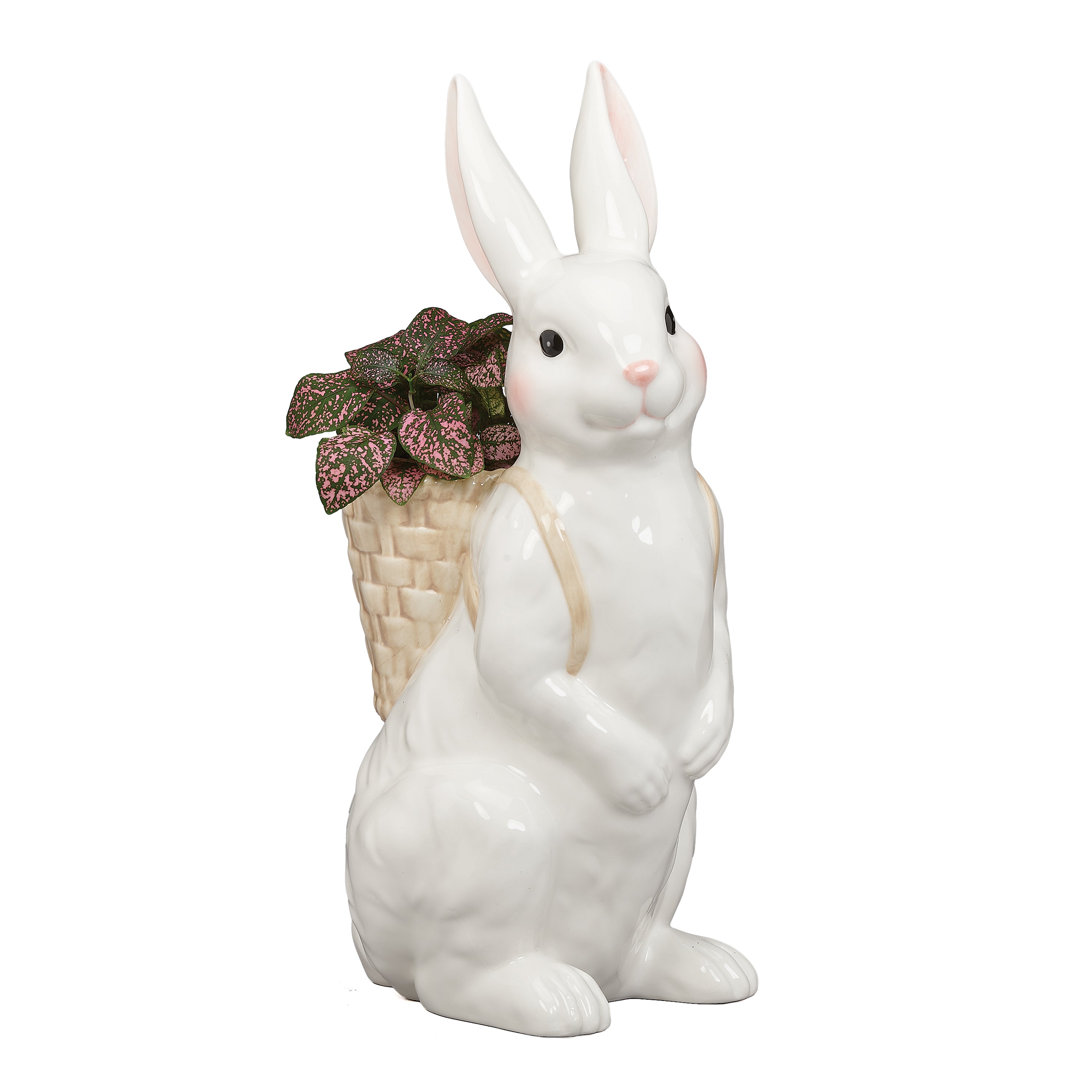 White ceramic rabbit figurine holding a basket with a pink flower on a white background