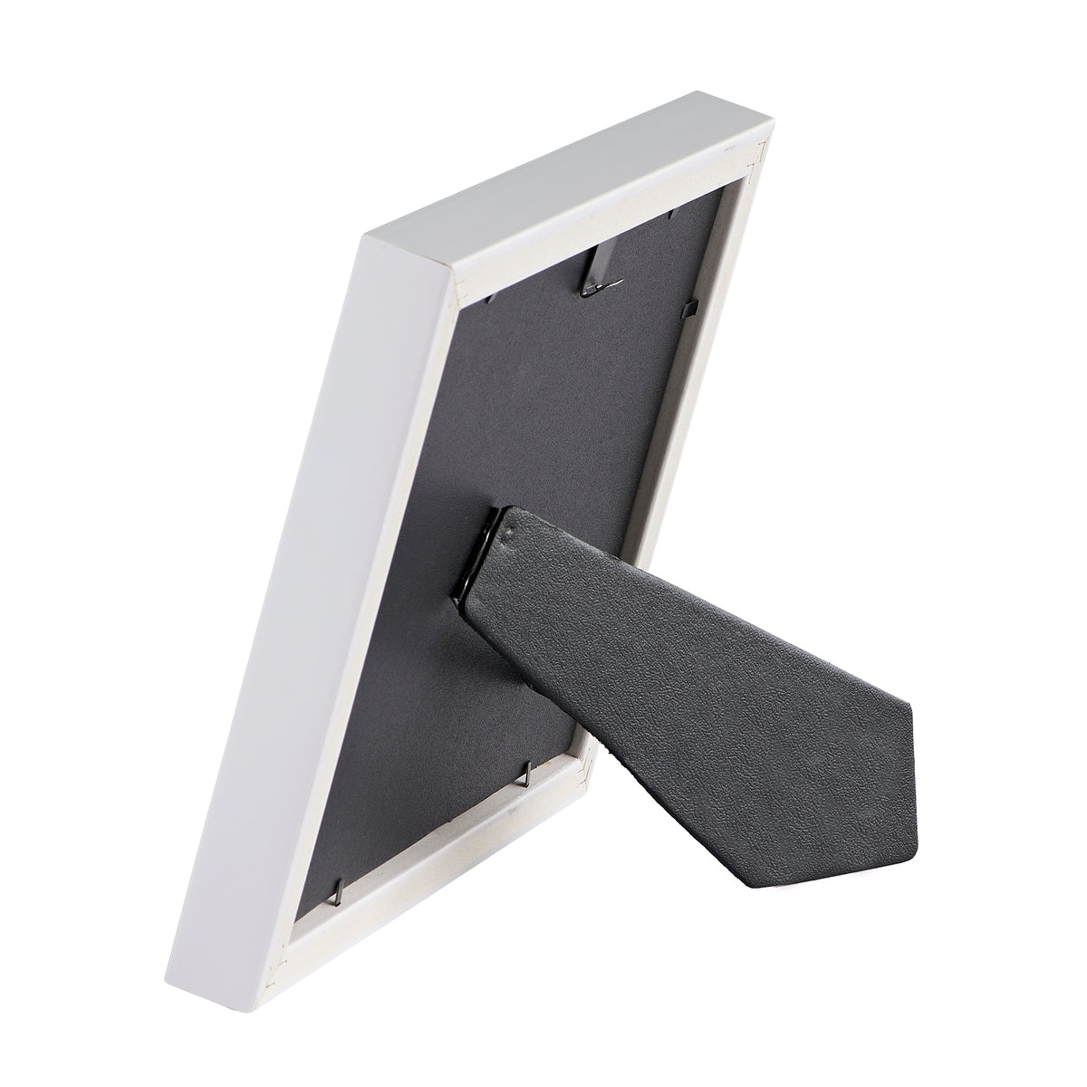 Rear angled view of Caroline Collection My First Communion picture frame showing the black backing and fold-out tabletop easel stand