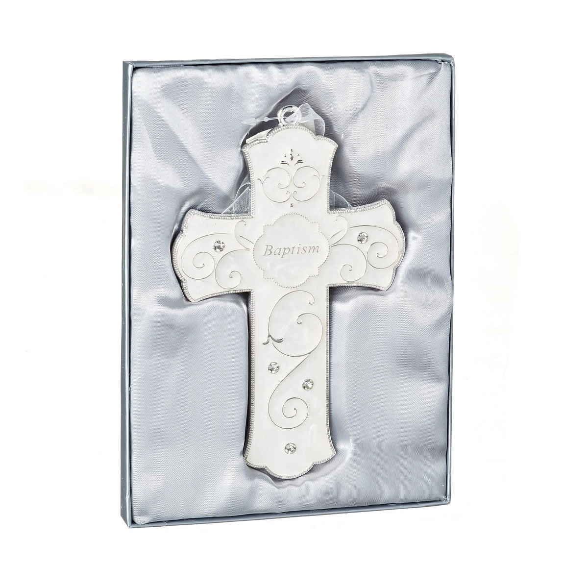 Caroline Collection Baptism Cross displayed in presentation packaging with the pearlescent white cross and silver scrollwork visible