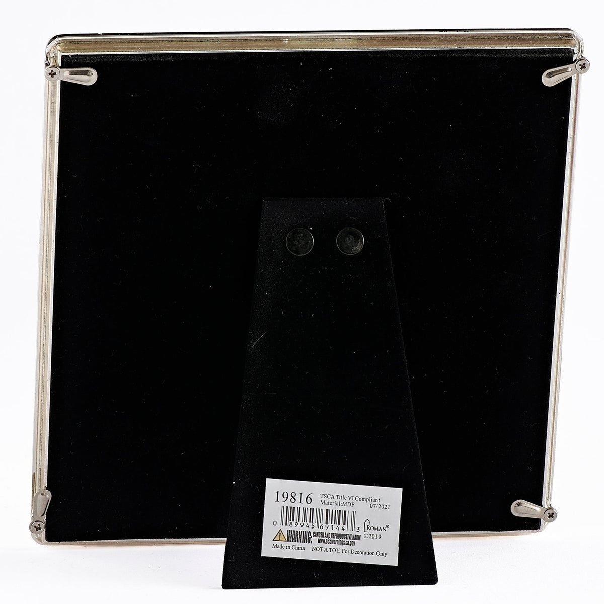 Back view of Caroline Collection First Communion picture frame showing the black backing and fold-out easel stand