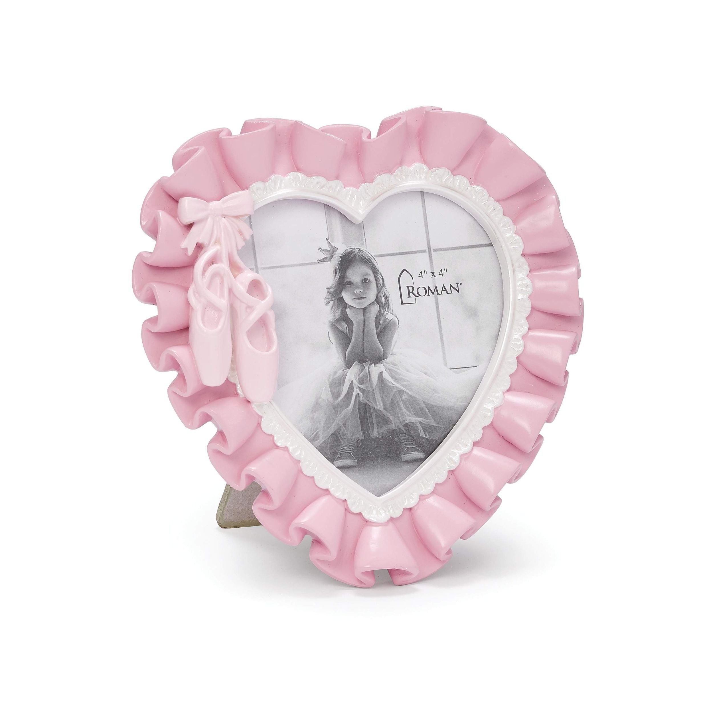 Heart-shaped photo frame with pink ruffles on a white background