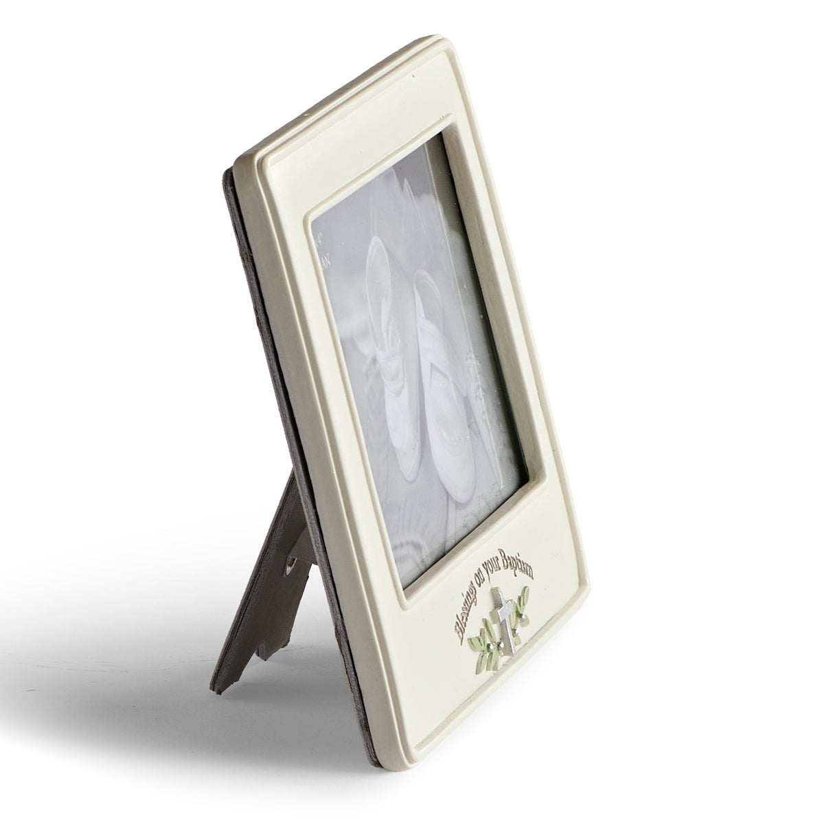 Front angled view of “Blessings on Your Baptism” picture frame showing the ivory frame, silver-tone cross detail, photo opening, and tabletop stand