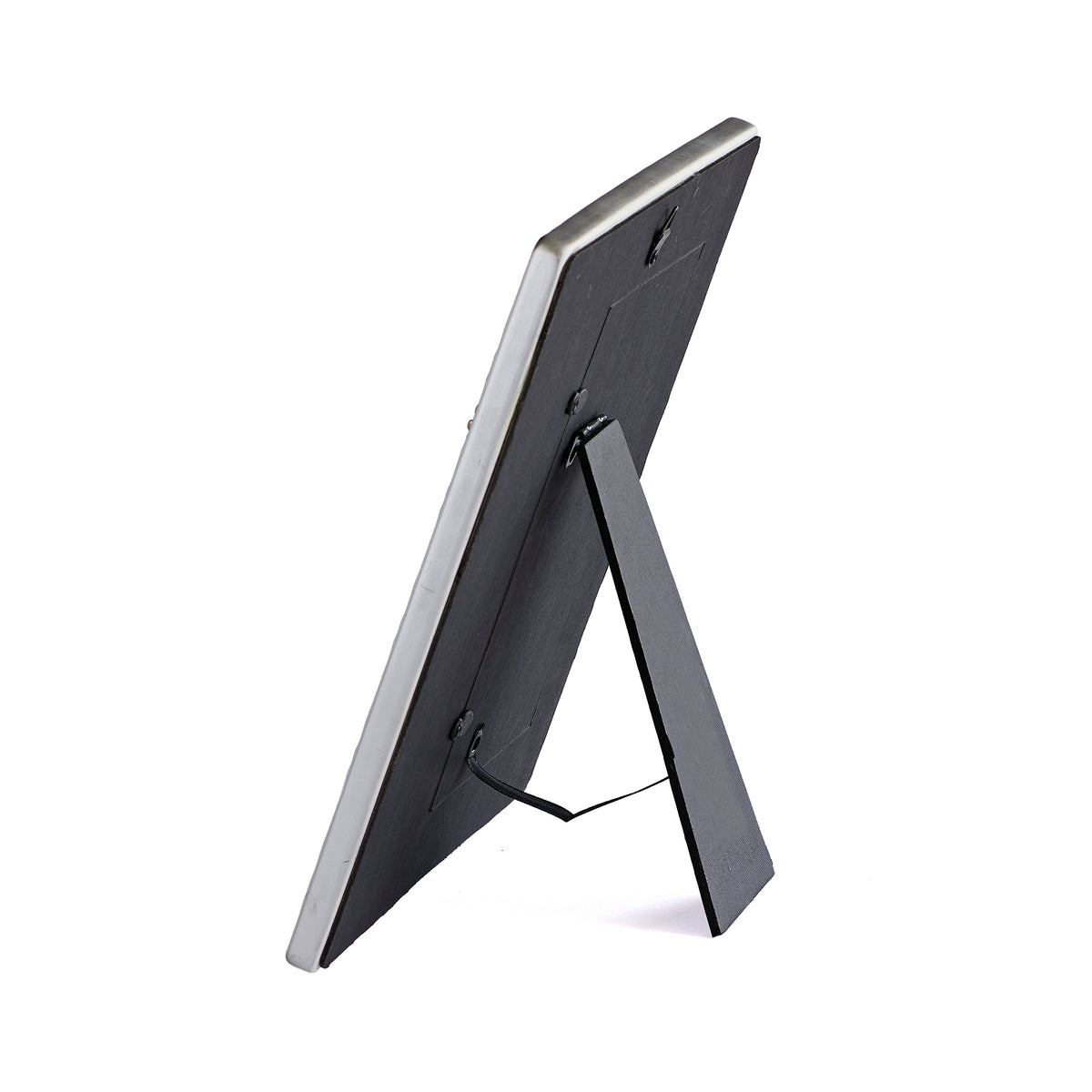 Rear angled view of I am the Bread of Life First Communion Picture Frame showing the dark backing and fold-out easel stand