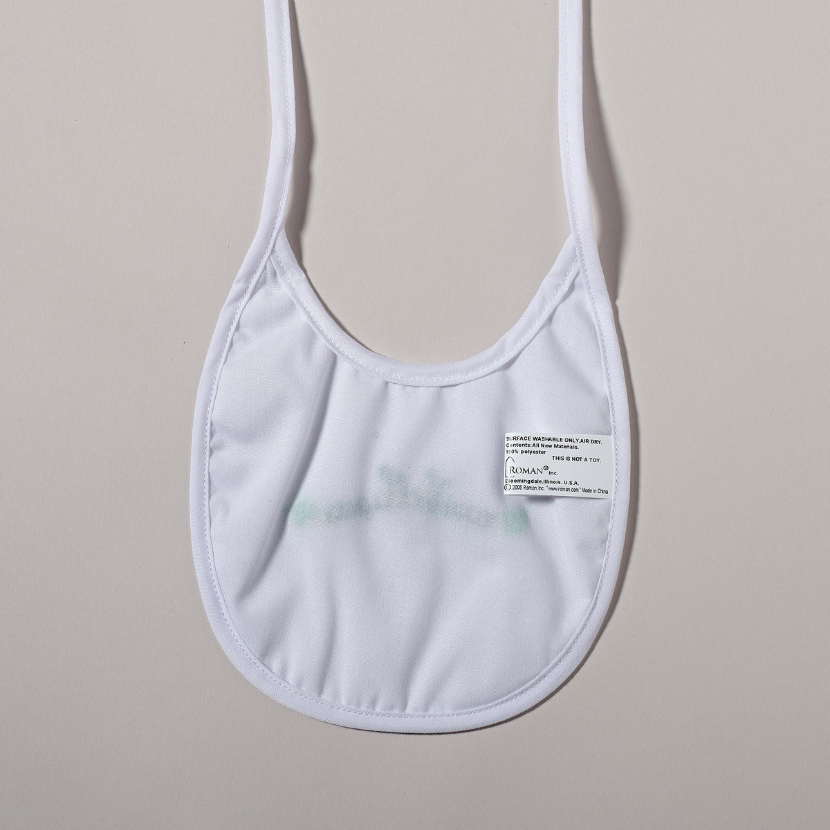 Back view of Wee Little One Irish Baptism Bib showing the plain white fabric and gathered shape