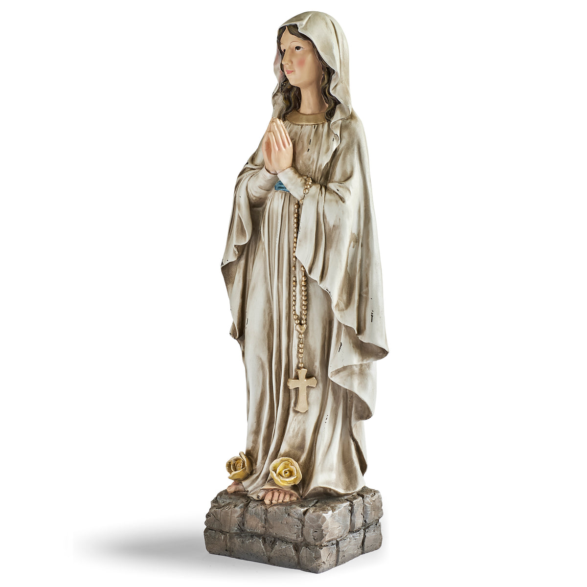 Front angled view of Distressed Our Lady of Lourdes Figure showing the prayerful pose, flowing robes, and yellow roses at the base