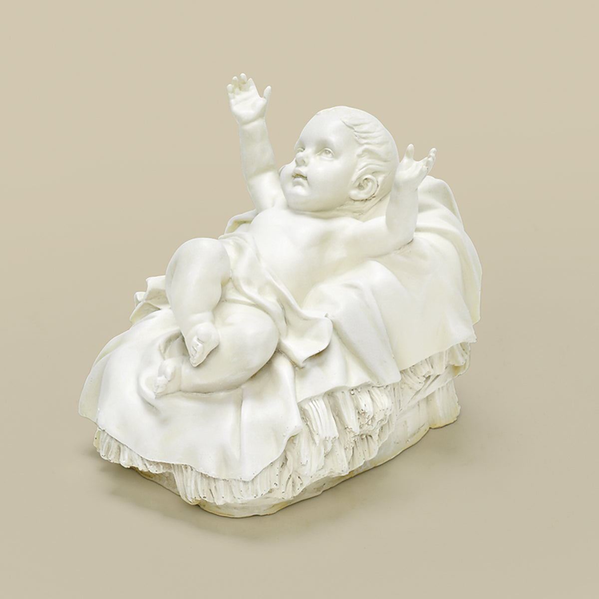 Alternate front angled view of Joseph's Studio Ivory Baby Jesus Garden Statue highlighting the raised arms, peaceful expression, and detailed ivory manger