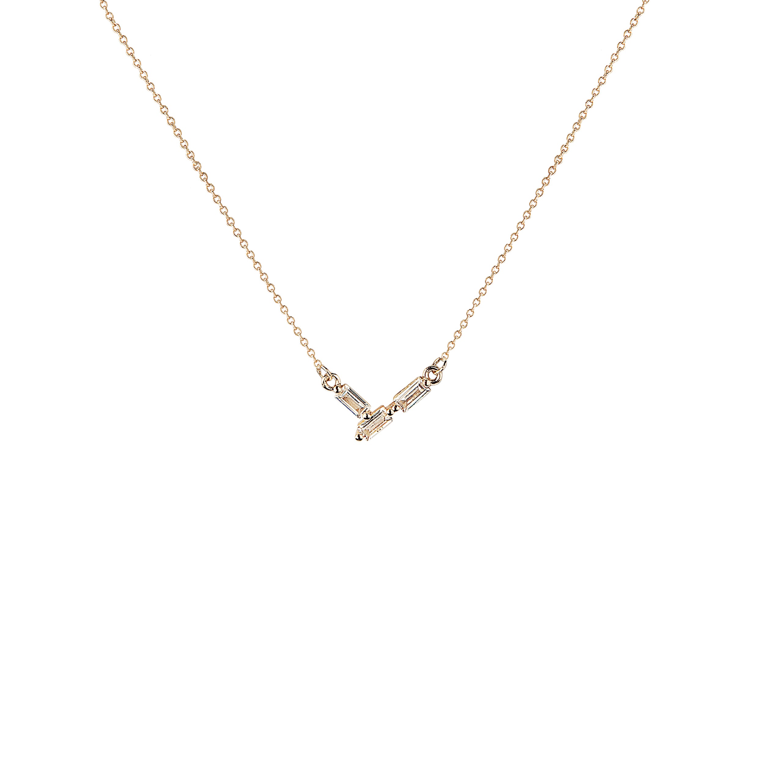 Gold necklace with a V-shaped pendant on a white background