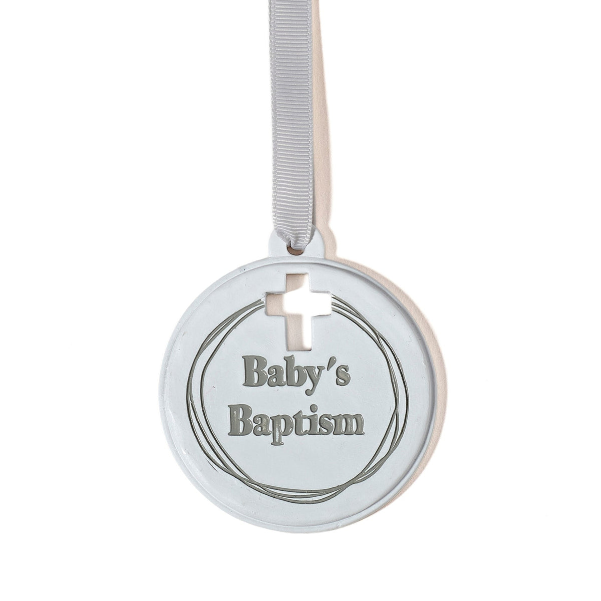 Baptism cradle medal hanging from a white ribbon with “Baby’s Baptism” inscription and soft blue-gray detailing