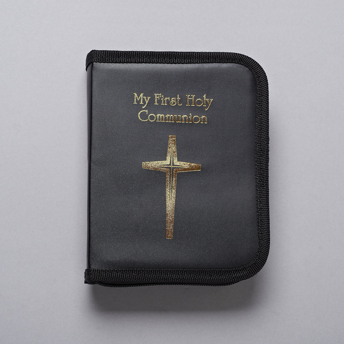 Closed My First Communion Boy's Folder Gift Set featuring a black zippered cover with gold "My First Communion" lettering and cross design