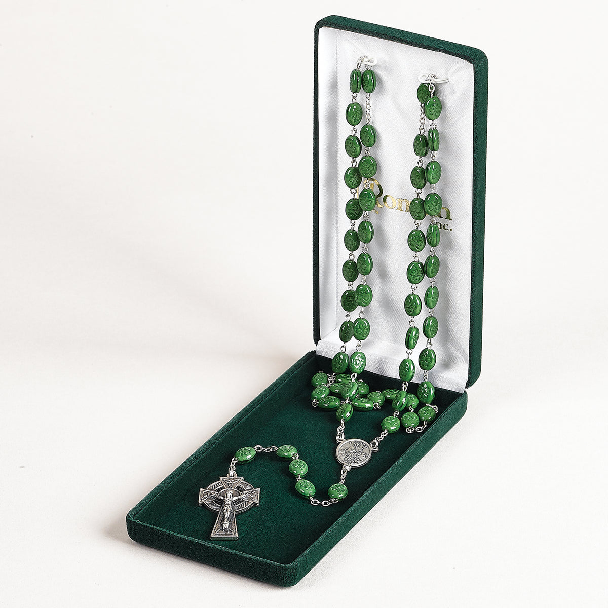 St. Patrick Rosary displayed in an open gift box with green beads and silver Celtic-style crucifix visible