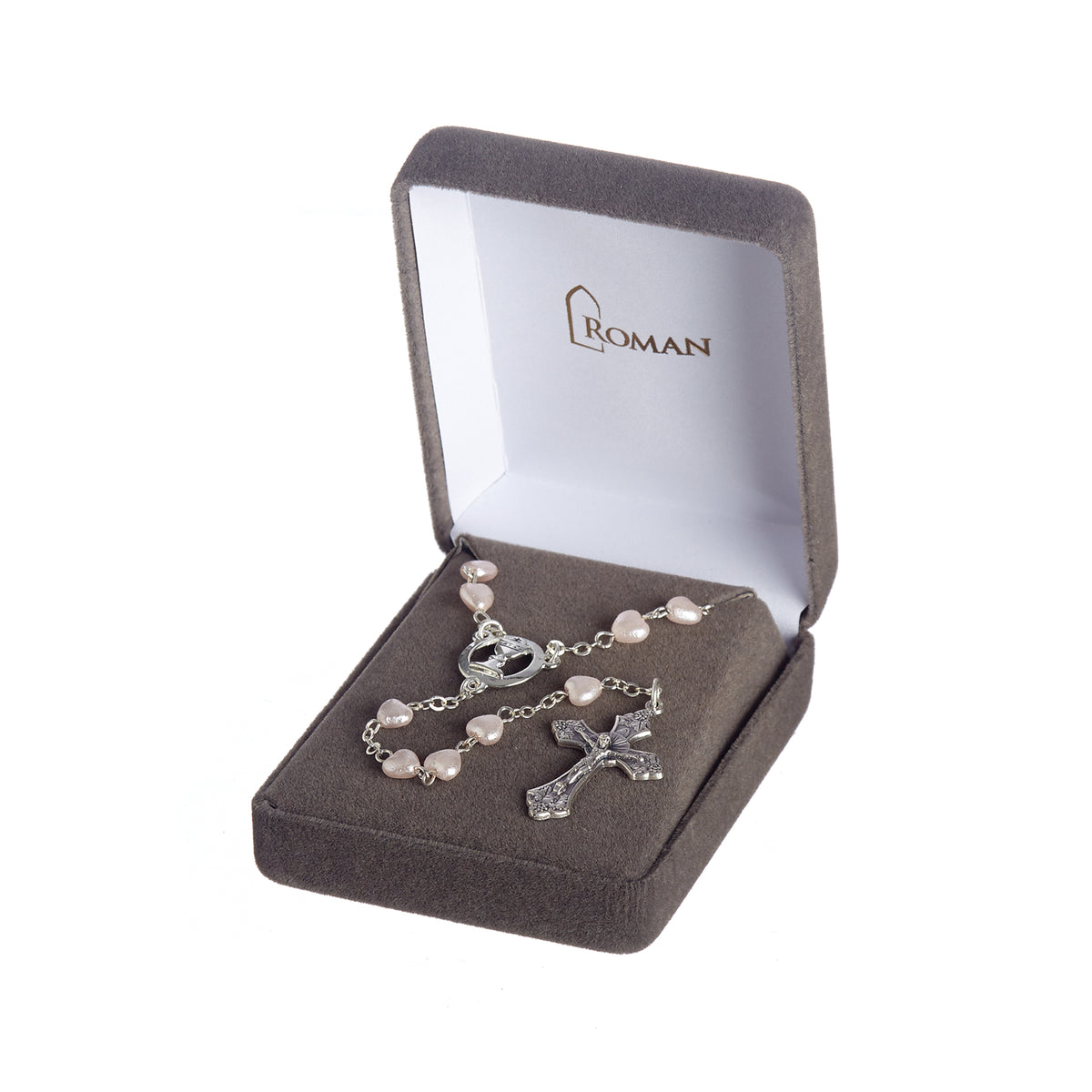 First Communion White Heart Rosary displayed inside a presentation box with the white heart-shaped beads, chalice centerpiece, and crucifix arranged inside