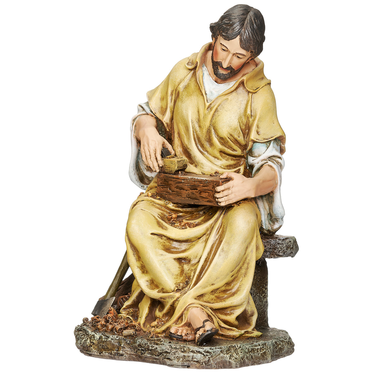 Front angled view of Joseph's Studio St. Joseph the Carpenter Figure showing St. Joseph working with wood and carpenter tools while seated
