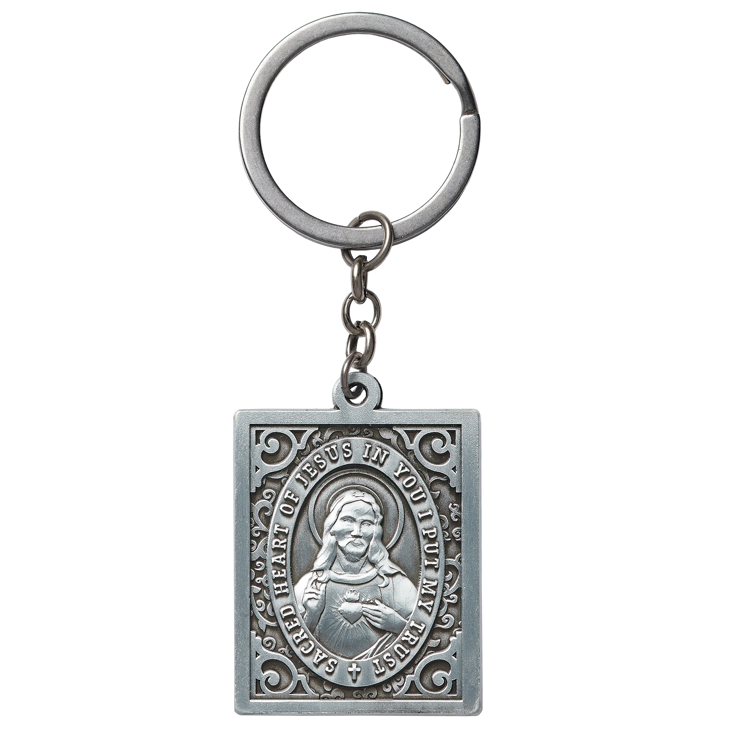 Silver keychain with religious design on a white background