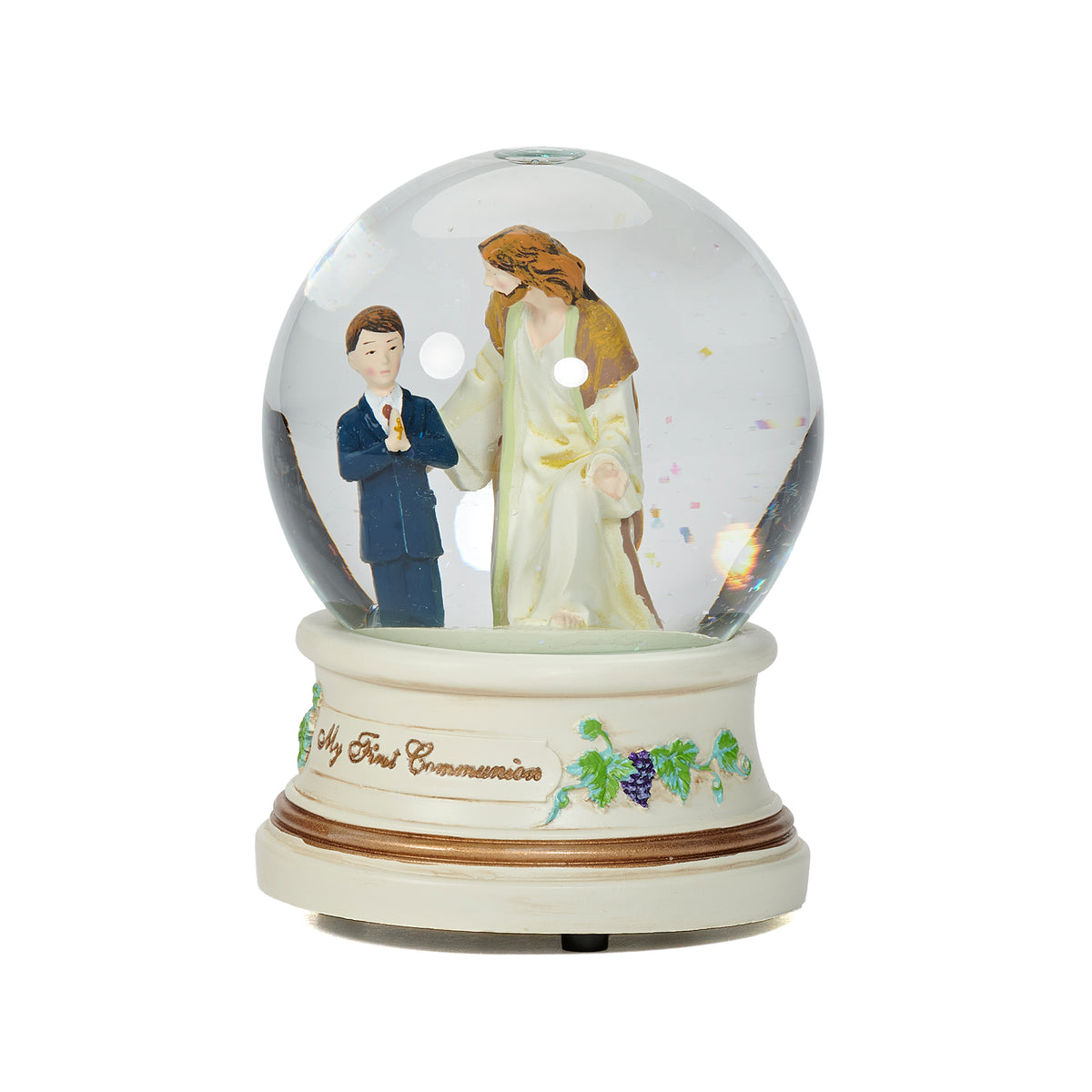 Front view of First Communion musical glitterdome showing the boy in blue beside Jesus with floral accents around the base