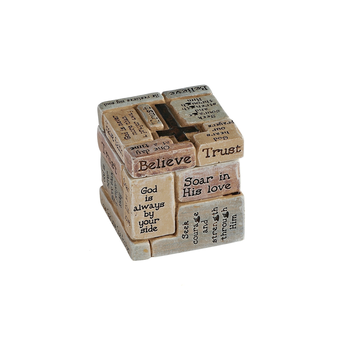 Angled view of trinket box showing the raised cross on its lid and patterned word panels.