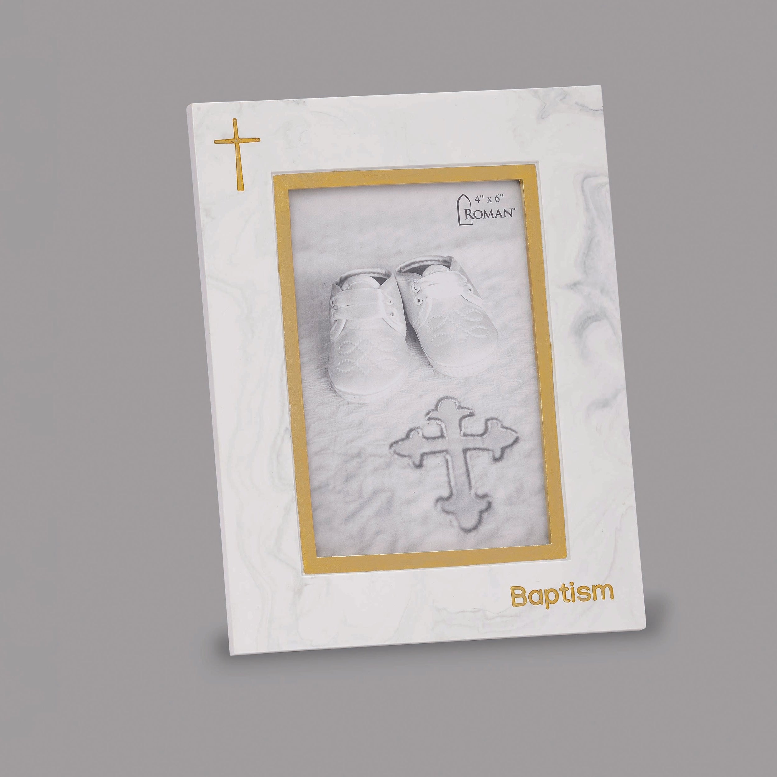 Baptismal card with baby's footprints and cross design on a gray background