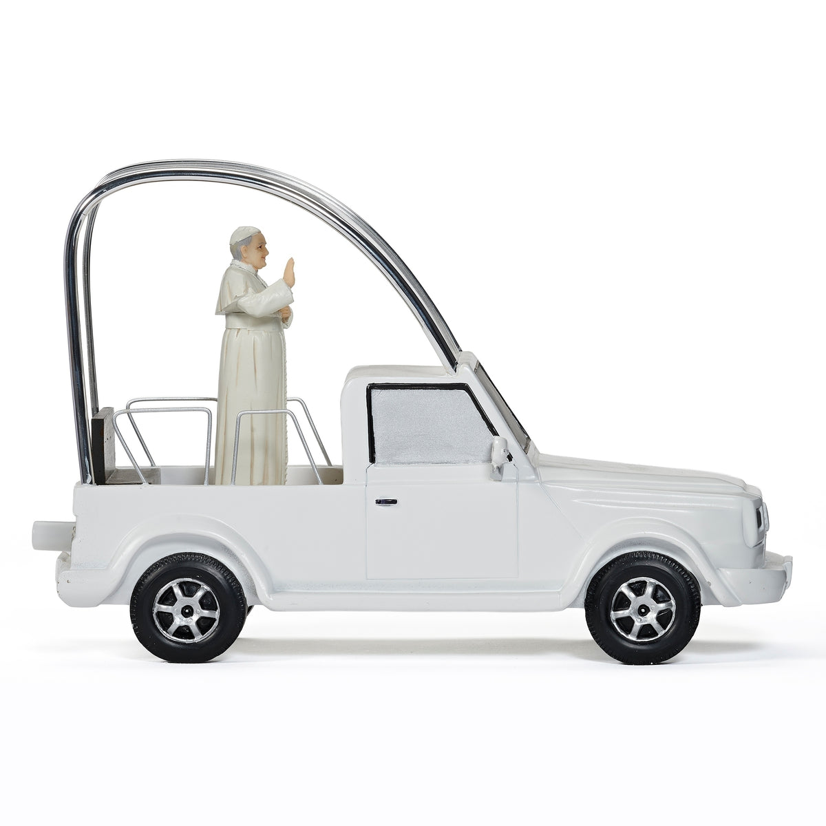 Side view of Musical Pope Mobile showing the white popemobile, clear canopy, Pope figure, and black wheels
