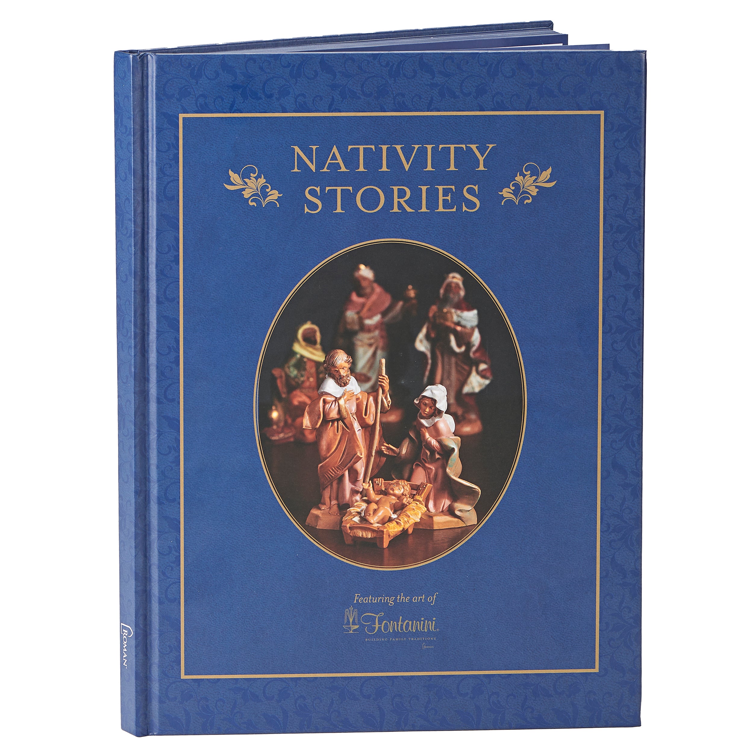A hardcover book titled 'NATIVITY STORIES' with a deep blue textured cover, gold border details, and a central oval photo window showing a nativity scene.