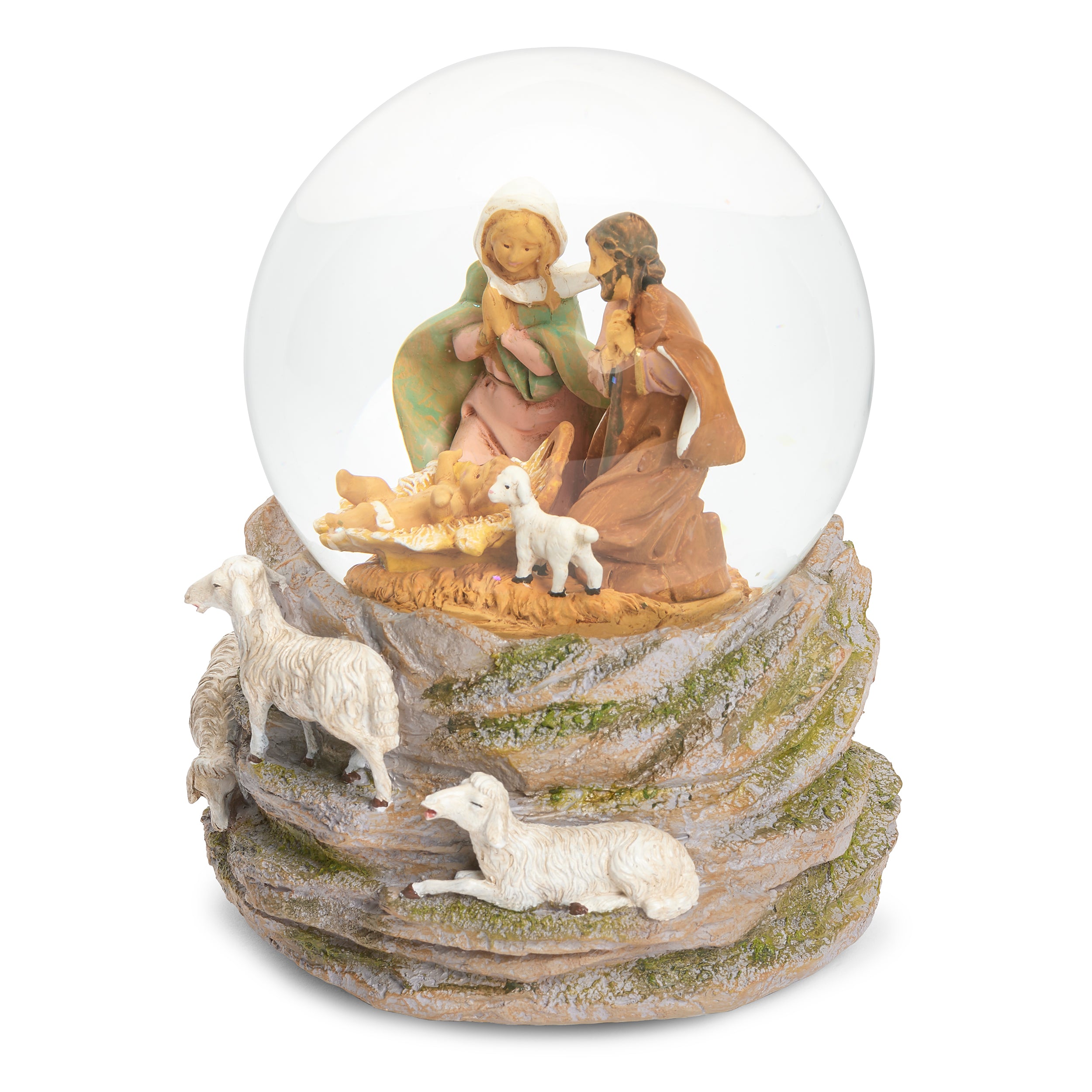 A nativity scene snow globe featuring Mary, Joseph, baby Jesus in a cradle, and three white sheep on a textured stone base, set against a plain white background.
