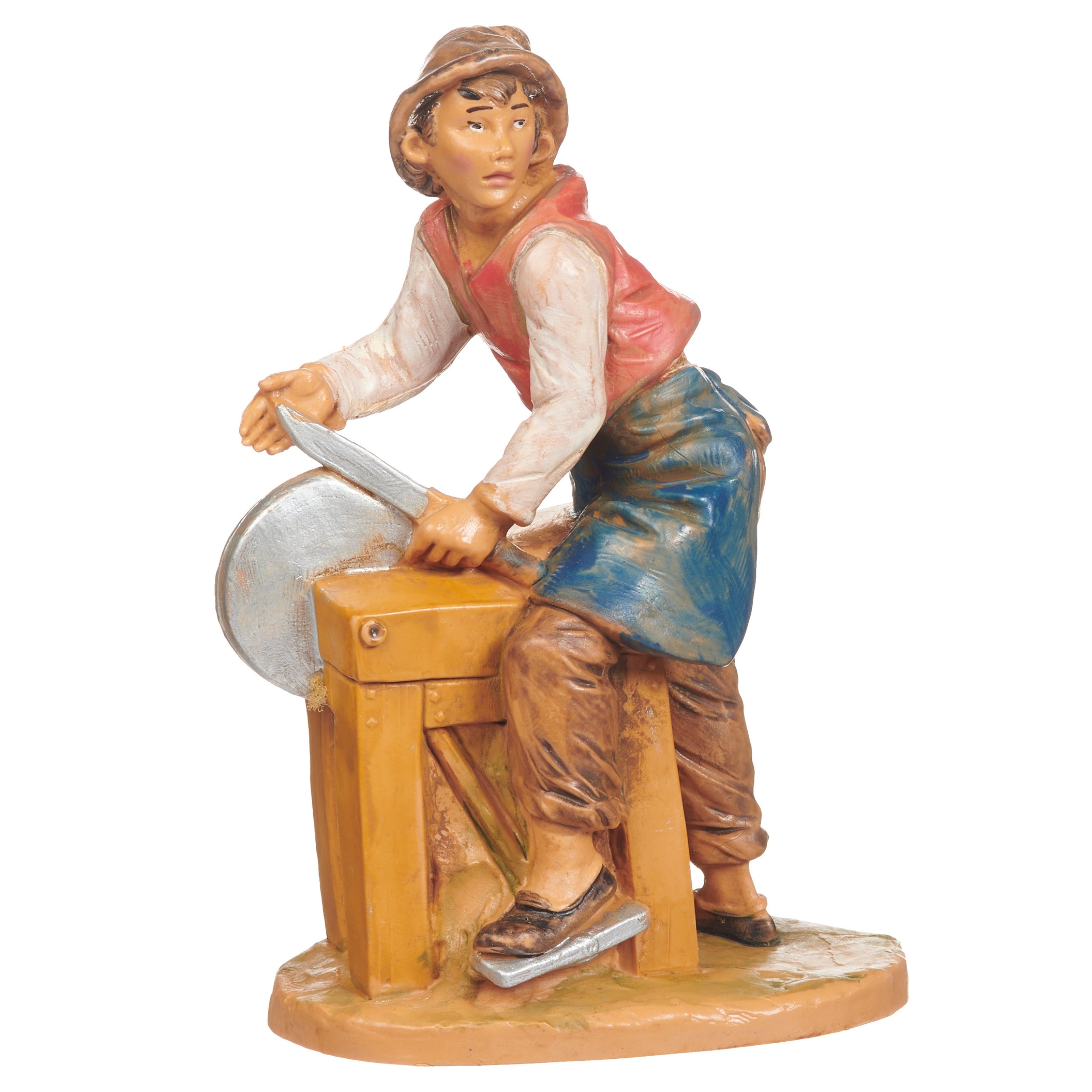 A hand-painted figurine of a craftsman or carpenter sitting on a wooden stool and sawing a piece of wood, set against a plain white background.
