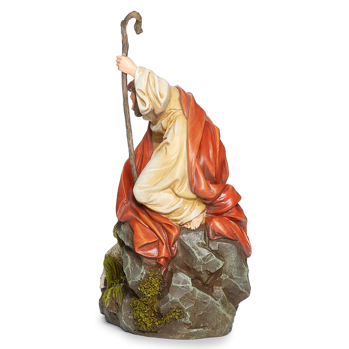 Opposite angled view of Joseph's Studio Jesus with Lamb Figure showing Jesus leaning toward the lamb beside the textured rock and greenery details