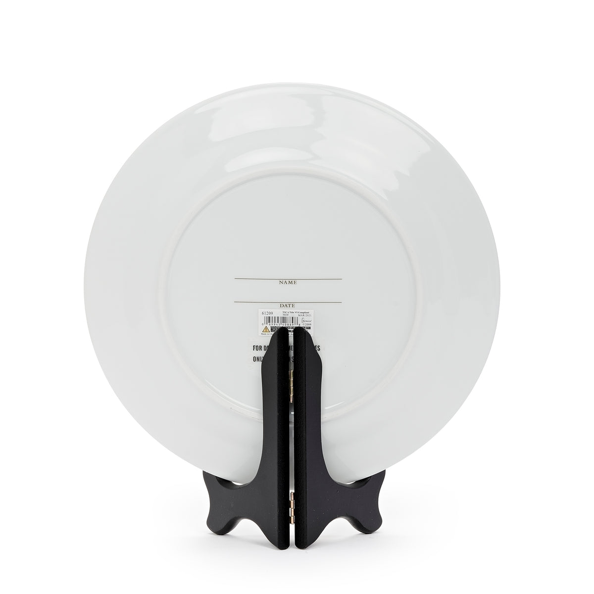 Rear view of anniversary plate showing its plain white back and supporting stand.