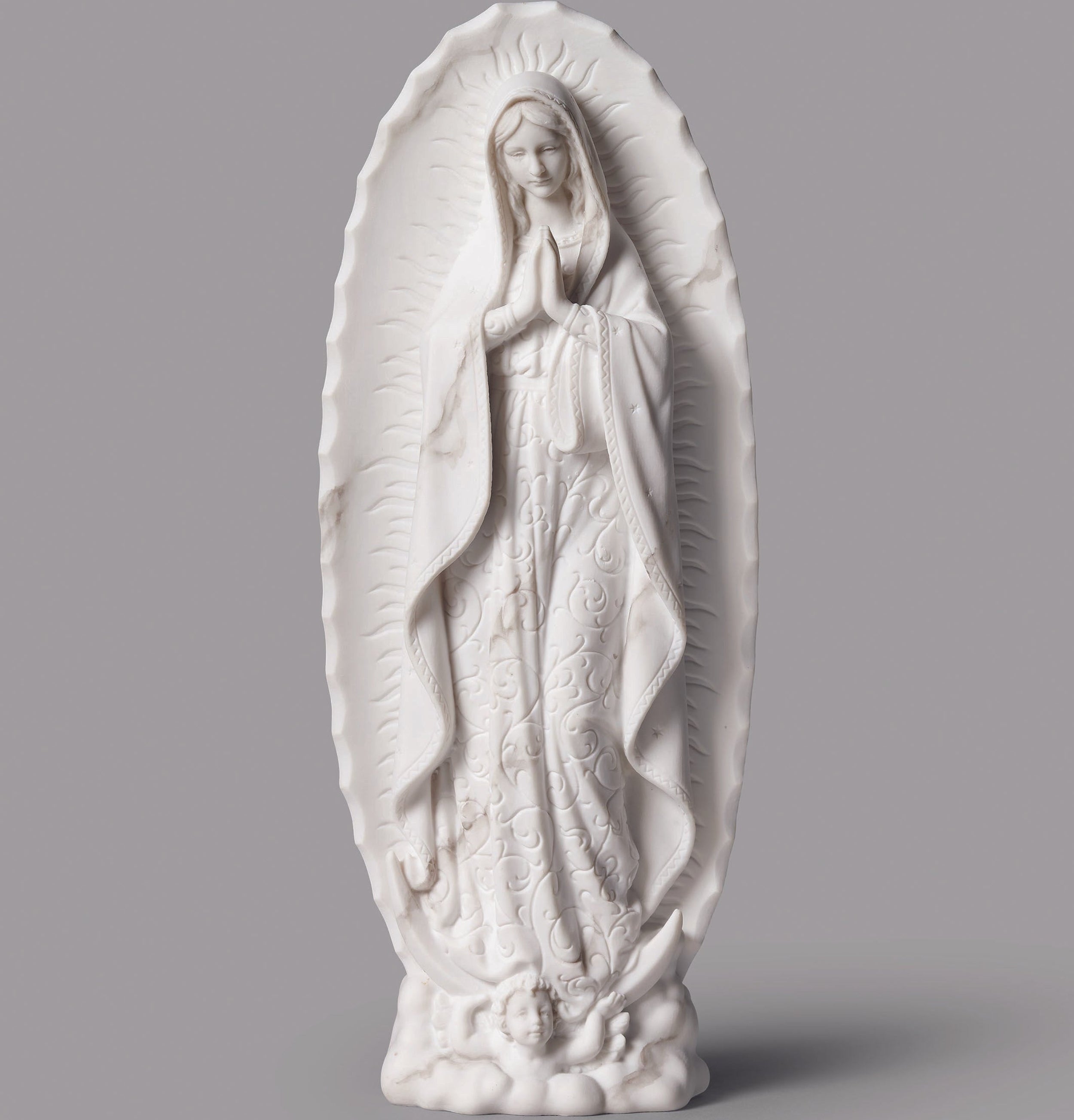 White statue of a religious figure on a gray background