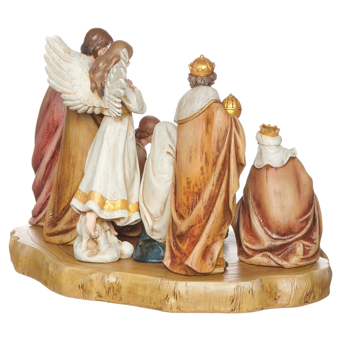 Rear angled view of Joseph's Studio Nativity Set with Faux Wood Base showing the angel, standing figures, and layered arrangement on the wood-look platform