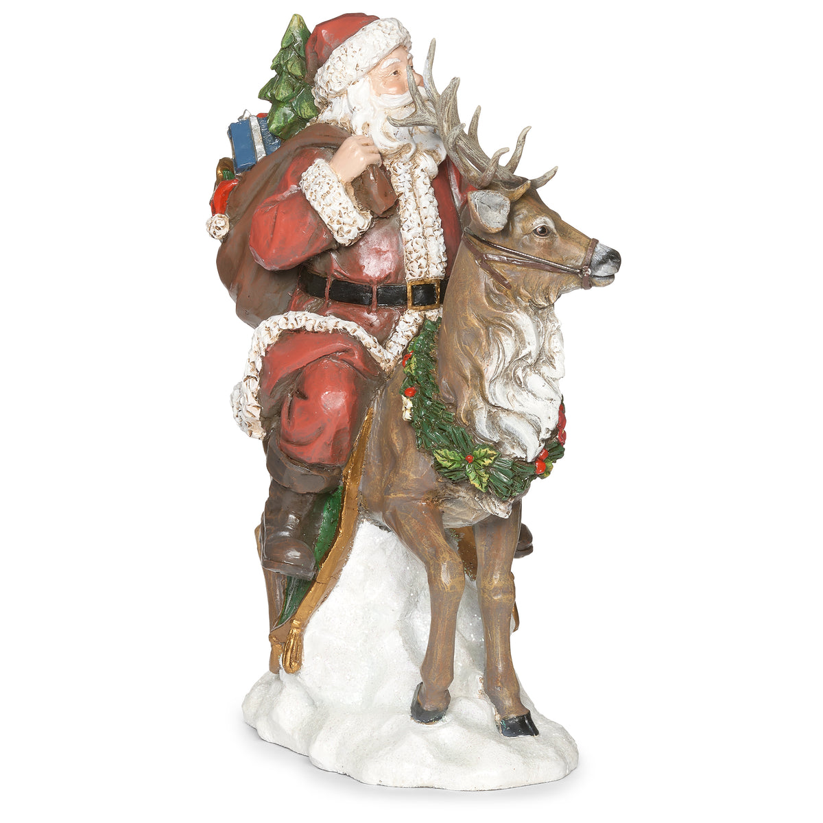 Opposite side view of Joseph's Studio Santa Riding Deer Figure showing Santa seated on the deer with the wreath, reins, and snowy base