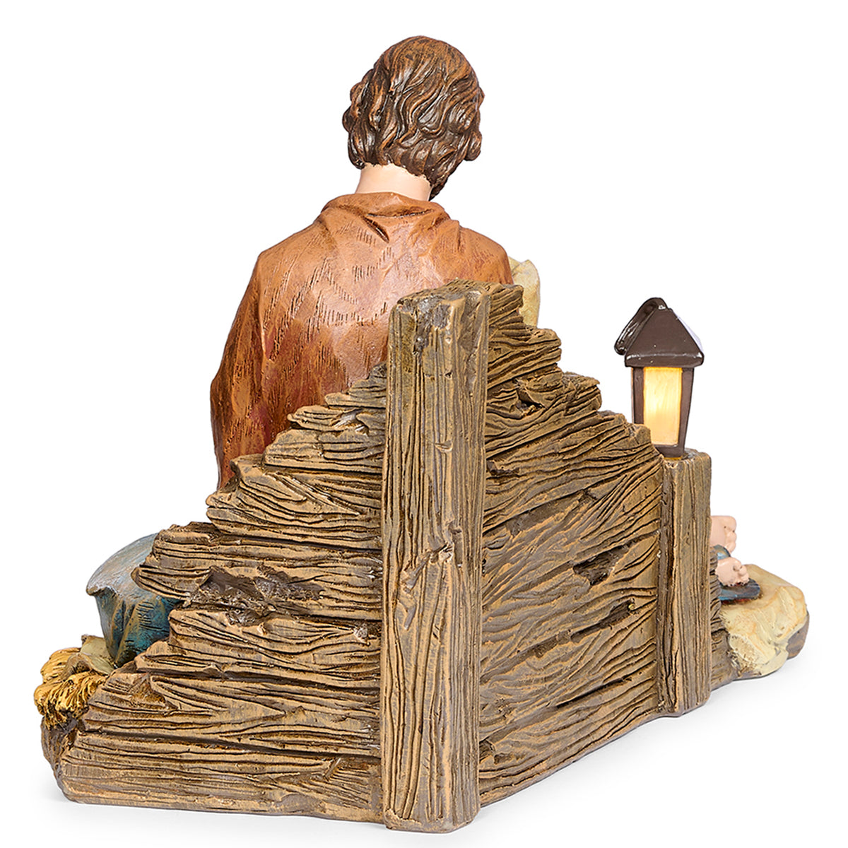 Back view of Joseph's Studio Lighted Sleeping Mary Holy Family Figure showing the textured wood-look structure, Joseph's robe, and lantern