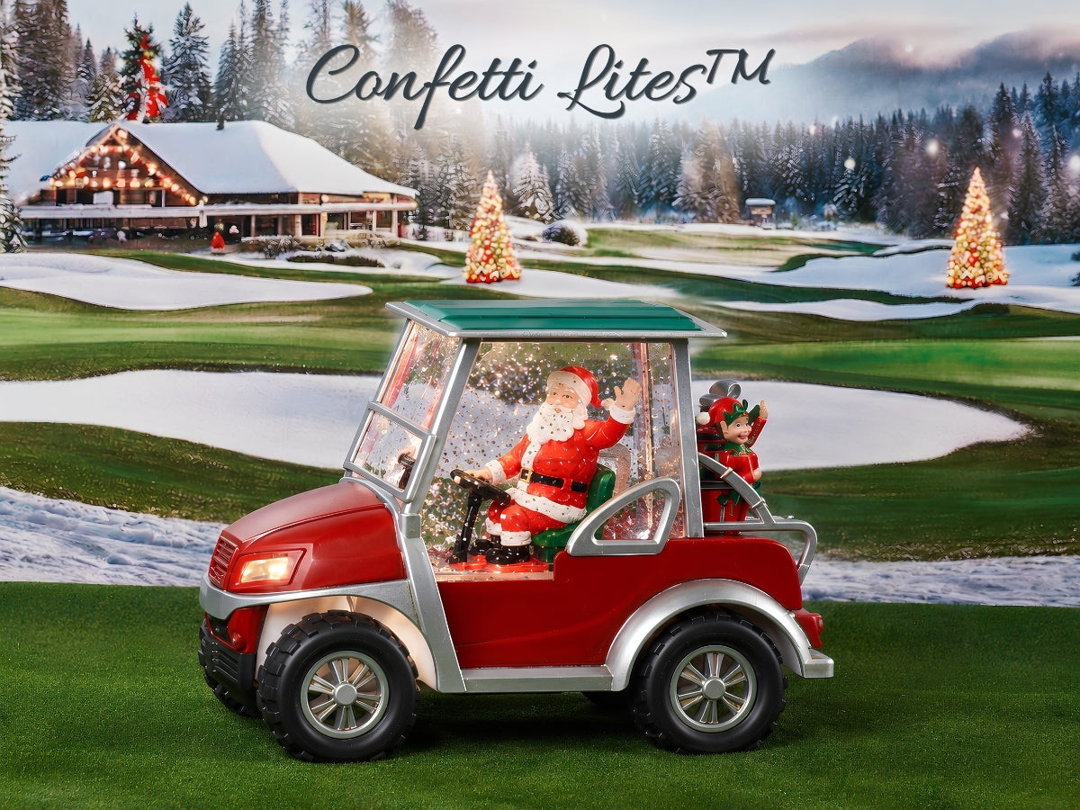 A red and silver golf cart with a green roof sits on a snowy golf course. Inside the cart, Santa Claus and a child are visible, surrounded by falling confetti.
