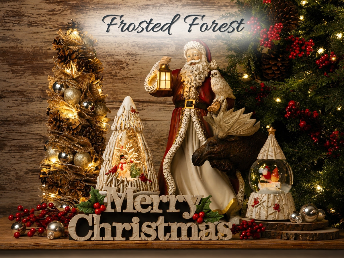 A festive Christmas holiday backdrop scene with a Santa Claus figurine holding a lantern, a moose ornament, a snow globe, a small decorated tree, and a larger frosted tree under a sign reading 'Merry Christmas' and 'Frosted Forest' against a rustic wood background.