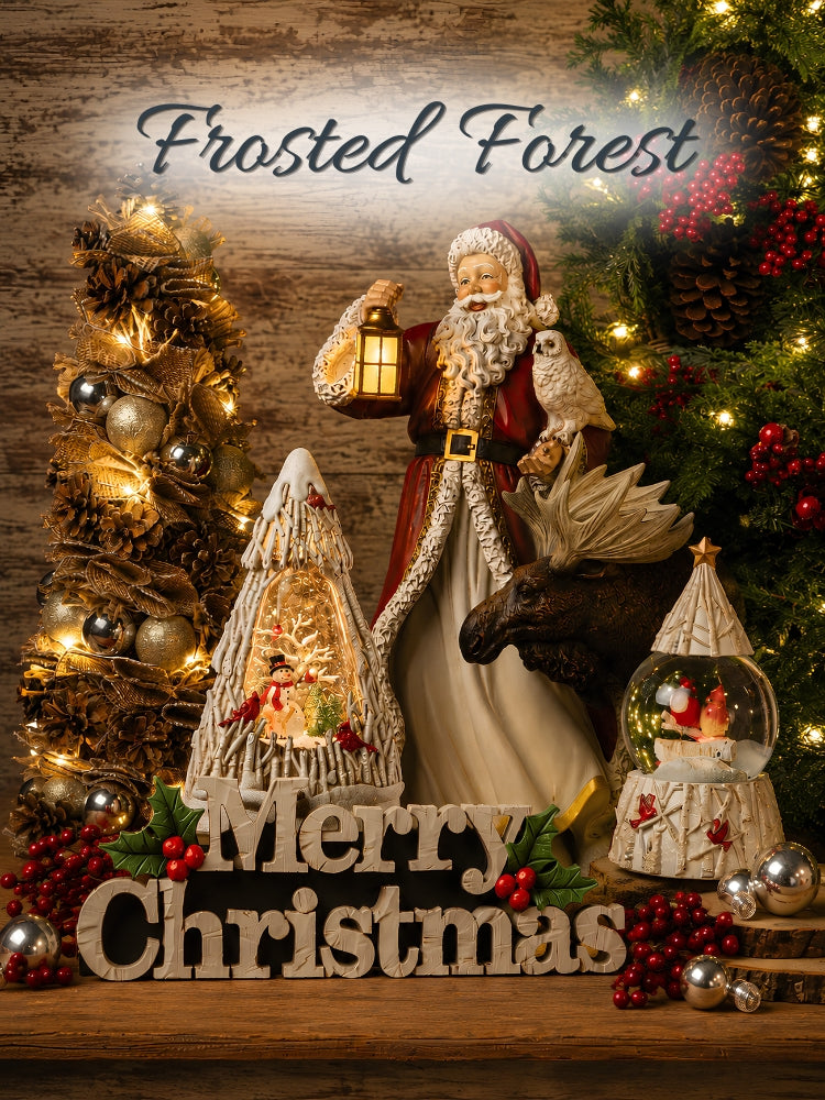 A festive Christmas holiday display with Santa Claus figurine holding a lantern, a moose head decoration, two snowflake-laden trees, a snow globe, red berries, pinecones, and warm string lights on a rustic wood background. Text overlays read 'Frosted Forest' at the top and 'Merry Christmas' at the bottom.