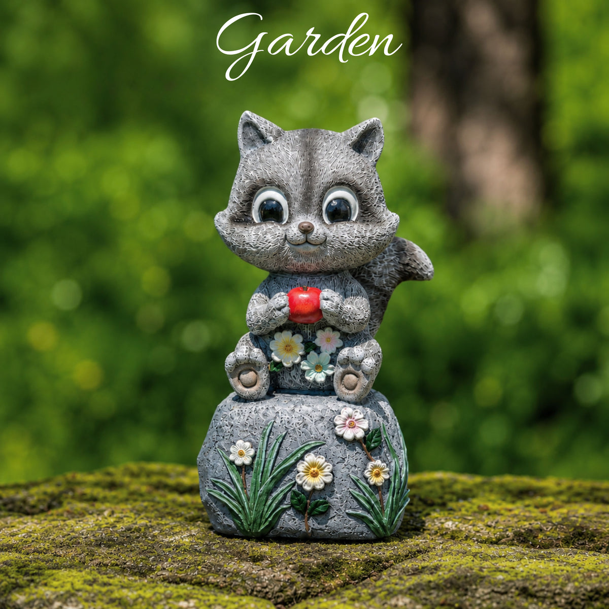 Stone cat figurine holding a red apple with flowers on a mossy surface, labeled 'Garden'.